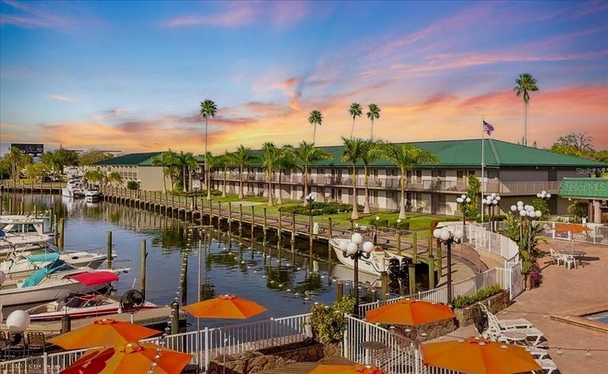 Rented Weekends Via AIRBNB. Showings available MON, TUES, WEDS. Welcome to Sarasota Cay Club, where every day feels like vacation and every night can add to your rental income! This 1 bedroom, 1 bath is located in the most popular building ADJACENT TO THE WATERFRONT on the FIRST FLOOR. It has been COMPLETELY REMODELED and comes FULLY FURNISHED with 2 double beds, stylish finishes, and everything you need to start enjoying (or renting) immediately. With NO MINIMUM RENTAL RESTRICTIONS, you’re free to maximize income through AIR BNB, VRBO, or the onsite rental program. What sets this property apart: the buildings wrap around a FULL-SERVICE MARINA with DIRECT SALTWATER GULF ACCESS. Walk right out your door and onto the dock. Residents enjoy access to a full-service marina, where boat slips are available for rent — perfect for keeping your own boat on site or hopping on a fishing charter just steps from your door. Owners and renters alike will love the easy boating lifestyle that makes this resort so desirable. The Ramada by Wyndham Sarasota Waterfront Resort setting means RESORT-STYLE AMENITIES are right outside your door: heated waterfront pool, tiki bar and waterfront restaurant, fitness center, beach volleyball, boat and kayak rentals, and scenic walking paths along the bay. A full support staff is available onsite for housekeeping, laundry, and restocking—making ownership and turnover simple. Monthly HOA fees include ALL UTILITIES: Electric, Water, Internet, Cable, Phone, Sewer, and Trash—keeping expenses predictable and worry-free. Ideally located just minutes from Sarasota-Bradenton Airport, downtown Sarasota, St. Armands Circle, IMG Academy, and the world-famous beaches, this property is the perfect blend of income opportunity and vacation getaway.