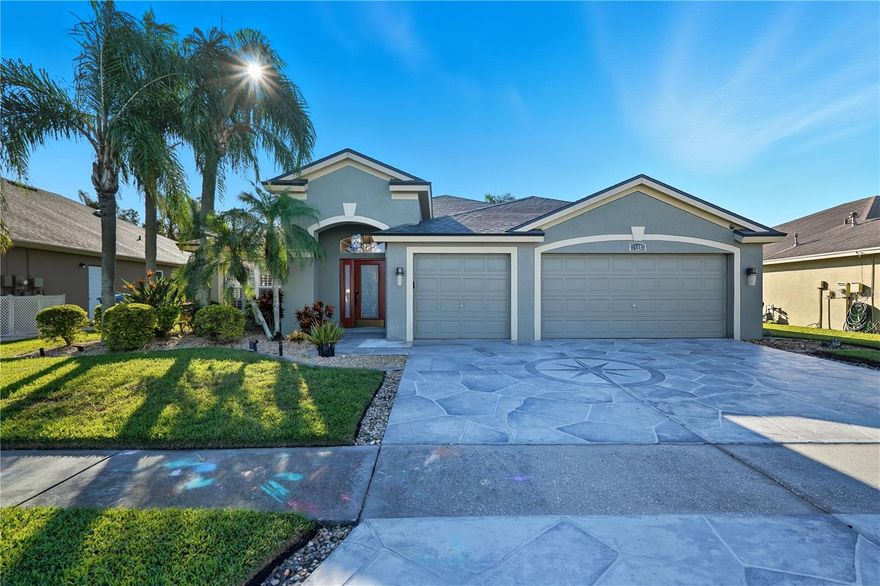 Welcome to your Florida oasis in the desirable Meadow Pointe community of Wesley Chapel! This well-maintained 4-bedroom, 3-bathroom home with a dedicated office offers the perfect blend of elegance, functionality, and resort-style living. With a 2023 roof, 2,400 sq. ft. of living space, a private pool, and a 3-car garage, this home truly has it all. Step through the front door into a bright, open floor plan highlighted by high ceilings, crown molding, and beautiful hardwood floors. The formal dining room features a stylish accent wall, while the living room and kitchen combo is ideal for entertaining or relaxing with family. The chef’s kitchen boasts granite countertops, upgraded stainless steel appliances, rich wooden cabinetry, a separate pantry, breakfast bar, and a cozy dining area overlooking the pool. With a split floor plan, you can retreat to the spacious primary suite, complete with a giant walk-in closet featuring built-in organizers and an updated, spa-like ensuite bath. Enjoy dual vanities, modern light fixtures and mirrors, a large glass-enclosed shower with multiple rain shower heads, an in-shower bench, and a private water closet - your own personal retreat. All additional bedrooms are generously sized, each with its own walk-in closet, while the front office offers flexibility as a 5th bedroom or guest space. The laundry room provides plenty of additional storage for everyday convenience. Step outside to your backyard paradise, featuring an expansive screened pool area, covered patio perfect for dining and lounging, and gorgeous lake views. Whether you’re hosting gatherings, grilling, or simply enjoying the Florida sunshine, this outdoor space is designed for relaxation and fun. Residents of Meadow Pointe enjoy resort-style amenities including sports courts, a community pool, playground, and clubhouse. All just minutes from The Shops at Wiregrass, I-275, and Wesley Chapel’s top dining and shopping options. Don’t miss this move-in ready pool home in a fantastic location. Schedule your private tour today!