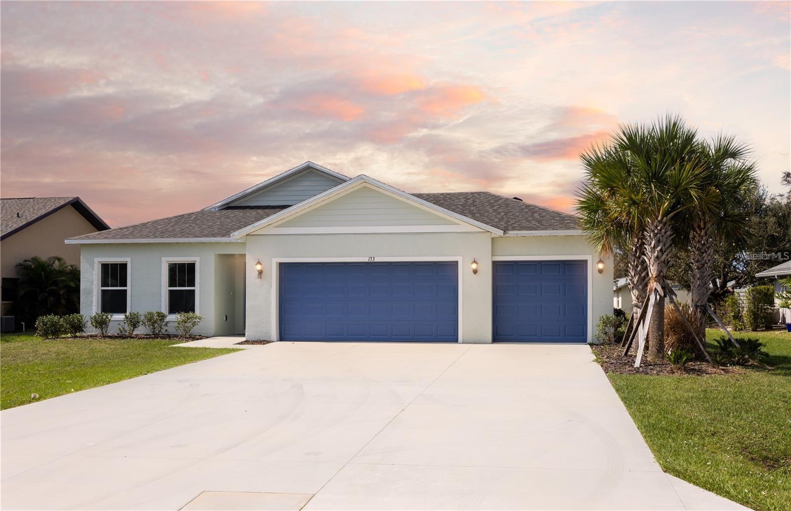 Short Sale. ***NEW CONSTRUCTION, NO WAIT, MOVE IN READY!*** Elevate your lifestyle with the opulence of the Sanibel II floorplan presented by Carpenter Homes—a masterpiece within the Florida Living Series, certified by the Florida Green Building Coalition (FGBC). This home features 4 bedrooms and 2 full bathrooms. This dream home is designed and built to immerse you in luxury!
As you enter, a beautiful kitchen welcomes you, with an expansive, oversized bar that seamlessly flows into the living and dining area. The finesse of soft-close, Painted Slate 36" cabinets, SoHo Canvas White 4x16 subway tile backsplash, and upgraded Miami White quartz countertops add a functional touch of luxury to the kitchen. Kitchen upgrades include a Moen Align matte black kitchen faucet, garbage disposal, and sleek stainless steel energy efficient appliances. This home exudes sophistication with a vaulted ceiling that unveils a spacious Florida Room, creating an indoor-outdoor haven. Additionally, Carpenter Homes provides an upgraded matte black lighting package including pendants over the kitchen bar, and vanity fixtures in both bathrooms, accenting the overall lighting design. Matte black finish ceiling fans in each bedroom, as well as the great room, helps to circulate air flow and keep you cool in the Florida weather. Complimenting the expansive living area is Magnisi Silver 18x18 ceramic tile flooring.
The Owner's suite is a sanctuary of indulgence, showcasing dual sinks, impeccably tiled Magnisi Silver 8x12 walls in the shower, and a generously sized walk-in closet.
The home boasts Magnisi Silver 8x12 upgraded tiled walls in in the second bath/shower, a Miami White quartz vanity top, and Moen Align matte black faucets and shower/tub trim kits. The ampleness of this home continues with a utility room, and additions such as energy-efficient R-4.1 insulation on concrete exterior walls, Taexx tubes for pest control, and fabric hurricane shutters for every window. The Florida friendly landscaped yard is complemented by an irrigation system with a rain sensor to help maximize efficiency.