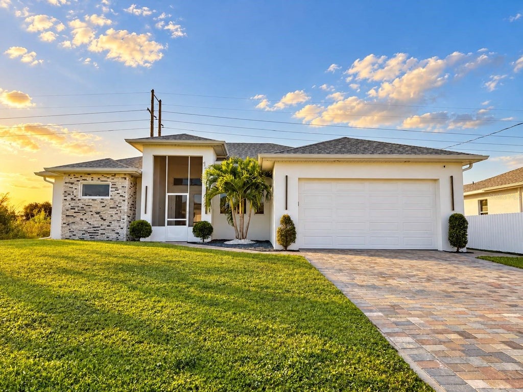 Photo of 1106 Floyd Avenue S, Lehigh Acres, FL 33976 (MLS # O6452829)