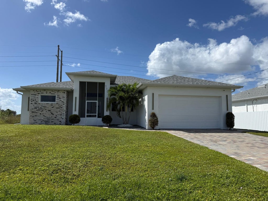 Photo of 1106 Floyd Avenue S, Lehigh Acres, FL 33976 (MLS # O6452829)