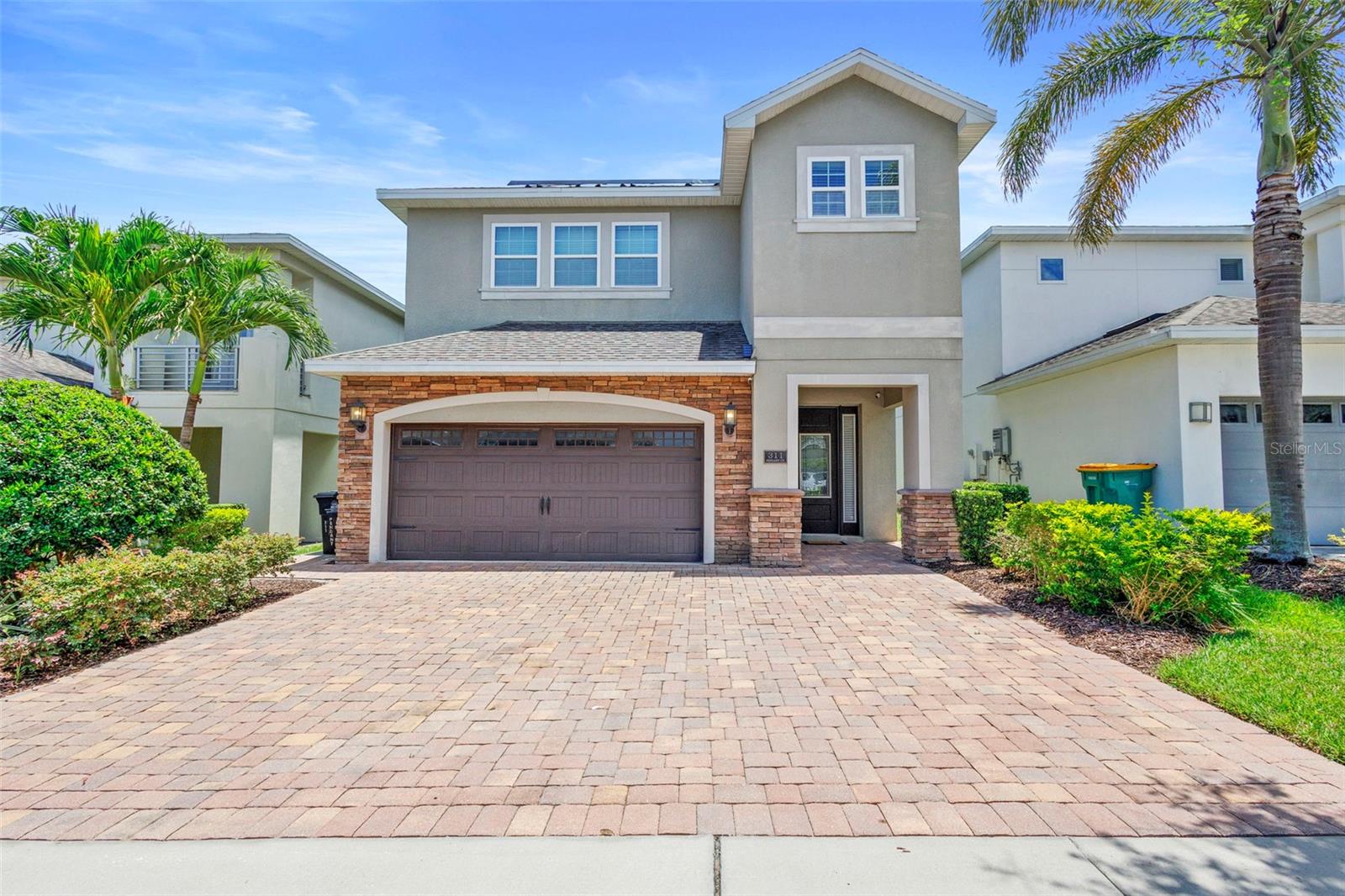 Welcome to this Luxurious Vacation Home Near Disney with Premium Upgrades.
Located in the highly sought-after Reunion West community, just 6 miles from Walt Disney World® and close to Universal Studios, SeaWorld, and championship golf courses by Palmer, Watson, and Nicklaus, this exceptional 6-bedroom, 6.5-bathroom estate, (one bedroom is being used as an office) is the ultimate vacation getaway or investment opportunity.
Fully furnished and professionally designed, this home features a spacious, open-concept layout ideal for entertaining or relaxing. The interior boasts upgraded wood-look tile flooring on the main level and in all bathrooms, rich dark laminate wood flooring throughout the rest of the home—no carpet anywhere! Check out the Star Wars-themed home theater with upgraded seating for immersive entertainment. Home to your very own fantasy worlds with two custom-themed bedrooms designed to enchant guests of all ages—one capturing the magic of Frozen, the other bringing the excitement of Oga’s Cantina from Disney’s Star Wars: Galaxy’s Edge to life! Just look at those textured walls!!
Functional upgrades include an oversized Samsung Flex washer and dryer, five interior locking owner’s closets for secure storage, additional washer dryer hook ups in owner's suite, and a high-end epoxy finish on the garage floor with storage shelving and refrigerator.
Green energy and tech-forward features include a free and clear 18KW solar system leading to minimal electric bills, Level 2 EV charger to effortlessly and conveniently charge your electric vehicles, and ARLO security cameras for additional security and peace of mind.
Whether its been a thrilling day at the parks, shopping at the outlets or getting in 18 holes of golf - take a well-deserved break in your own private gas heated pool and spa—an ideal retreat to relax and recharge. Whether you're soaking in the spa under the stars or lounging poolside with a cool drink, it's the perfect way to unwind. The extended patio nearly doubles the standard size, with premium Gran Floridian patio furniture. Eastern exposure providing shaded evenings, and NO REAR NEIGHBORS for added privacy. If you're not ready for the fun to end, head over to the RESORT STYLE clubhouse and waterpark, where the little ones can splash and play while adults enjoy a drink or two by the pool.
As part of Club Encore at Reunion West, enjoy exclusive access to world-class amenities: a 5-acre water park with lazy river and water slides, three signature golf courses, tennis and pickleball courts, over 10 resort pools, a modern fitness center, on-site dining, daily activities and complimentary shuttle service to Walt Disney World®.
Whether you're seeking a high-performing short-term rental, a second home, or a luxurious retreat in the heart of Central Florida, this one-of-a-kind property offers unmatched comfort, style, and value.
Buy with confidence as ONE YEAR Home Warranty offered by Seller