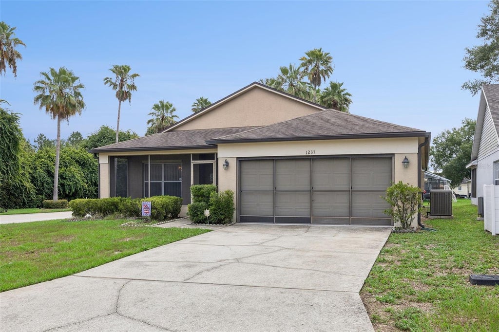 Photo of 1237 Woodflower Way, Clermont, FL 34711 (MLS # O6421859)