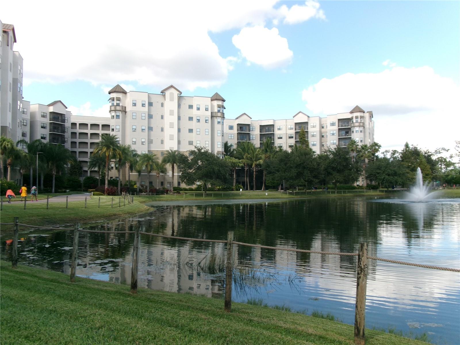 Exceptional 6th floor Vacation Condo unit with Water and Conservation views plus Evening Fireworks views from your private South-facing Balcony at The Grove Resort and Spa/Water Park in Orlando near Walt Disney World! Experience the Resort FUN yourself and enjoy the income-producing option to rent out your unit when you are away. This Full-service Fully-furnished Luxury Resort unit is the Birch model (split plan 1375 sq ft) in Bldg 1 section H; Two bedroom suites plus sleeper sofa in the great room, TVs in all rooms, Fully equipped Kitchen, inside private Laundry room, a short walk to Attached Garage parking, and the Fitness Center is conveniently just downstairs! Experience lifetime memories at the multitude of amenities on site: the Surfari Water Park with an amazing FlowRider Surf Simulator, Lazy River, Water slides, numerous pools and activities, cabanas, meeting areas, shopping options and Family Fun Center, or escape just minutes away to neighboring theme parks, shopping, restaurants, and more!