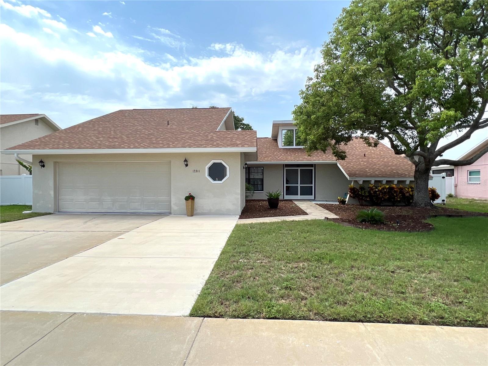 JUST LISTED! Beautiful 3 bedroom and 2 bathroom home located in the Lakeside Woodlands community. As you walk up to the home you will notice an oversized two car garage.This home offers a spacious layout with lots of natural light exposure. The living/dining room combo is perfect for entertaining guests. You will notice the kitchen has updated granite counter tops and stainless steel appliances. Plus the kitchen offers lots of cabinet space and counter space. Now make way out to the screened in pool area. This area has pavers and is the perfect spot to take advantage of the beautiful Florida weather. It looks out to your fully vinyl fenced back yard. Don't miss your chance to see this pool home today!