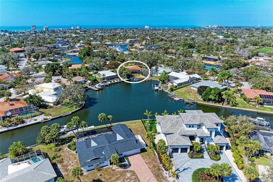 A BOATER'S DREAM! Welcome to your Siesta Key waterfront dream home on a third of an acre lot! Private dock with a 7,000lb boat lift. Move right in and start enjoying the island lifestyle! This home features great water view on the widest part of the canal! Brand new landscaping and freshly painted exterior. Sold furnished with a few exceptions. The heated pool and panoramic pool cage create a serene setting. Hurricane rated windows, new dishwasher and refrigerator, wine refrigerator, custom wood cabinets and granite counters. Tile floors and engineered wood, built-out closets, open floor plan, 2 car garage, circular driveway, outdoor shower. 3 bedrooms and 3 full bathrooms plus laundry room. A few blocks from world famous SIESTA BEACH, short drive to downtown Sarasota, St Armand's, Lido and much more. ***THIS HOME HAS NOT HAD ANY STORM DAMAGE AND NO FLOODING.***