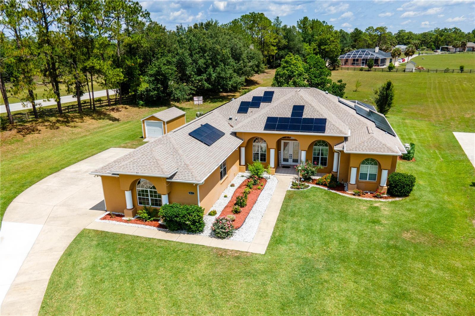Stunning 3-Bedroom 3-Bath Home with Pool, Office, TWO KITCHENS, and a whole House Generator on 1.99 Acres!
Welcome to your dream home! This spacious 3-bedroom, 3-bathroom residence boasts an impressive 3,230 square feet of living space with high and cathedral ceilings, nestled on 1.99 acres of beautifully landscaped property in a tranquil cul-de-sac.
Step inside to discover a versatile split floor plan featuring a formal living room, formal dining room, office, family room, laundry room, and a completely enclosed air conditioned porch with a second full service kitchen! The heart of the home is the expansive kitchen, complete with granite countertops, high-end stainless steel appliances, and a smart refrigerator that conveys. Enjoy casual meals at the countertop bar, seamlessly connected to the inviting family room.
Retreat to the luxurious master bedroom, which features a grand master bath with his and hers sinks, a relaxing garden tub, a spacious stand-up shower with multiple shower heads, and his and hers walk-in closets. The family room showcases a gas fireplace, a stylish brick accent wall, built-in shelving, and exquisite canned lighting, while circular windows add a unique design touch.
Entertainment options abound with a beautiful new swimming pool featuring a waterfall and screen cage, a hot tub, and a gazebo. Relax in the oversized, fully enclosed porch that includes a separate air conditioning system and its own full operational kitchen—ideal for gatherings, cooking, and parties!
The property also includes a bonus in home office space, a convenient shed, and a 3-car garage with epoxy flooring. Enjoy energy savings with solar panels (paid in full at closing) and peace of mind with a whole-house generator and outdoor security lighting. Recent upgrades include a new roof (February 2022) and well-maintained gutters and downspouts.
This home is clean, bright, and meticulously maintained, featuring ceramic tile in the main areas and wood-looking tile in the bedrooms. With ample outdoor space for gardening and an extended driveway, this property is ready to welcome you home!
Don’t miss your chance to own this incredible property, perfect for anyone looking for space, comfort, and quality living. Call today for a private showing!