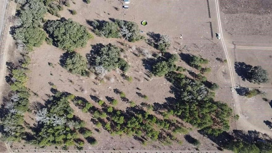 1.25 ACRE lot in Archer, FL. Zoned RR and located in Flood Zone X, this property offers potential to build your dream home or vacation getaway. With no HOA in place, you have the freedom to design and build your ideal living space without any restrictions or limitations. Power is at the lot. Whether you prefer a site-built home or manufactured home, this lot offers endless possibilities. Enjoy the quiet of the country with being close enough to Gainesville. Please confirm with the county any of your plans for this property. Listing agent is a member of the selling LLC.