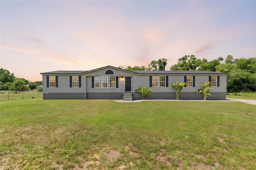 One or more photo(s) has been virtually staged. Beautifully restored and full of charm, this spacious 4-bedroom, 2-bath manufactured home in Temple Terrace Woods offers the perfect blend of comfort, flexibility, and privacy. Set on nearly half an acre with a peaceful retention pond alongside, the property delivers a tucked-away feel while still being conveniently close to everything Tampa has to offer.

Inside, you’ll find over 2,000 square feet of well-designed living space, including a split floor plan, a generous family room with a fireplace, and a large kitchen with ample storage. The oversized primary suite features a garden tub and separate shower.

This home has been thoughtfully updated with a new roof featuring HD dimensional shingles, a new 5-ton heat pump A/C, new water heater, all-new LED lighting, and fresh paint and trim throughout. Enjoy new Mohawk flooring, new kitchen cabinets with solid butcher block countertops, high-end stainless appliances, and new bathroom vanities with granite tops. Additional upgrades include custom double-hang closets and new premium skirting.

Outside, you’ll find an 11' x 12' shed with new shingles, a 20' x 20' carport, and the property is serviced by well and septic. A rare opportunity for space, privacy, and value in a desirable Tampa location—schedule your showing today.