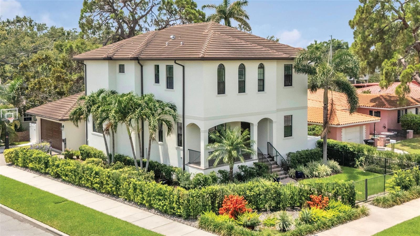 Timeless Modern Mediterranean on Snell Isle. This 2015 Devonshire custom home is a rare find—concrete block construction on both levels, 9-foot elevation, and a durable concrete tile roof add to the timeless curb appeal. Located in one of St. Petersburg’s most coveted neighborhoods—Snell Isle’s 900 block of Brightwaters Blvd NE—you’re just one scenic sidewalk away from downtown along Coffee Pot Bayou, surrounded by some of the most stunning waterfront estates in Pinellas County. Built for style and strength, this two-story modern Mediterranean offers hurricane-rated impact windows, doors, and roof, plus a whole-house natural gas generator (2020). Soaring 10ft ceilings upstairs and down add volume while the luxurious primary suite rivals those found in $10M+ homes—complete with a massive closet and oversized bath. 4 Bedrooms PLUS office. Additional highlights include: Flood insurance just $1,000/year. Homeowners insurance currently $2,000/year. Corner lot with lush mature landscaping & custom lighting. Generous storage throughout. All major systems and appliances from 2015. Enjoy quick access to the Vinoy Golf Club, Northshore Aquatic Center, Northshore and Straub Park and the nation’s second-longest contiguous waterfront park system. Just a mile from Trader Joe’s, Whole Foods, Publix and Fresh Market. This is more than a home - it's a lifestyle. Welcome to the best of Snell Isle!