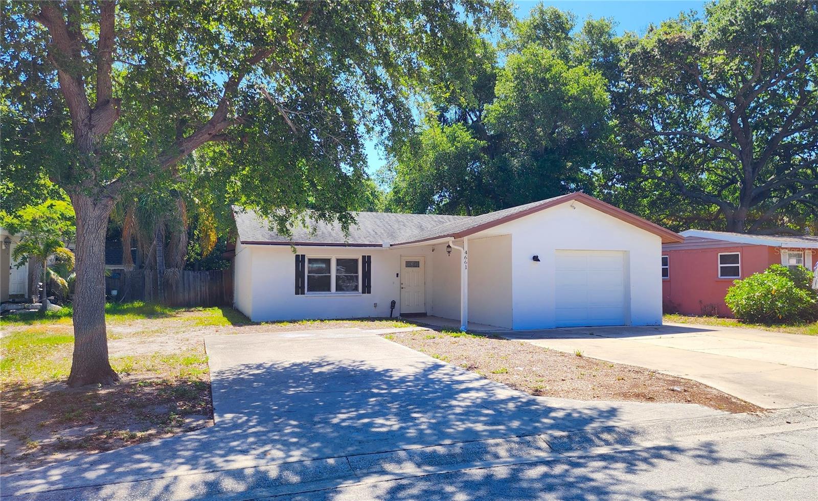 Don't miss out on this roomy 2 bedroom, 2 bathroom one story home with a 1 car garage. This home is conveniently located near shopping and restaurants and only minutes to the beautiful Gulf of Mexico sandy Beaches. New HVAC in 2022, newer appliances as well as HWH. Plenty of off street parking with 2 parking pads. The inside of the home offers living room, 2 bedrooms, 2 bathrooms one of which is the primary bathroom en-suite, kitchen, dining room and large rear family room with French doors taking you off to the huge fenced back yard. Primary Bedroom has a huge walk in closet. The one car garage is where the washer and dryer is as well as a garage door opener and a side service door to take you to the side yard.