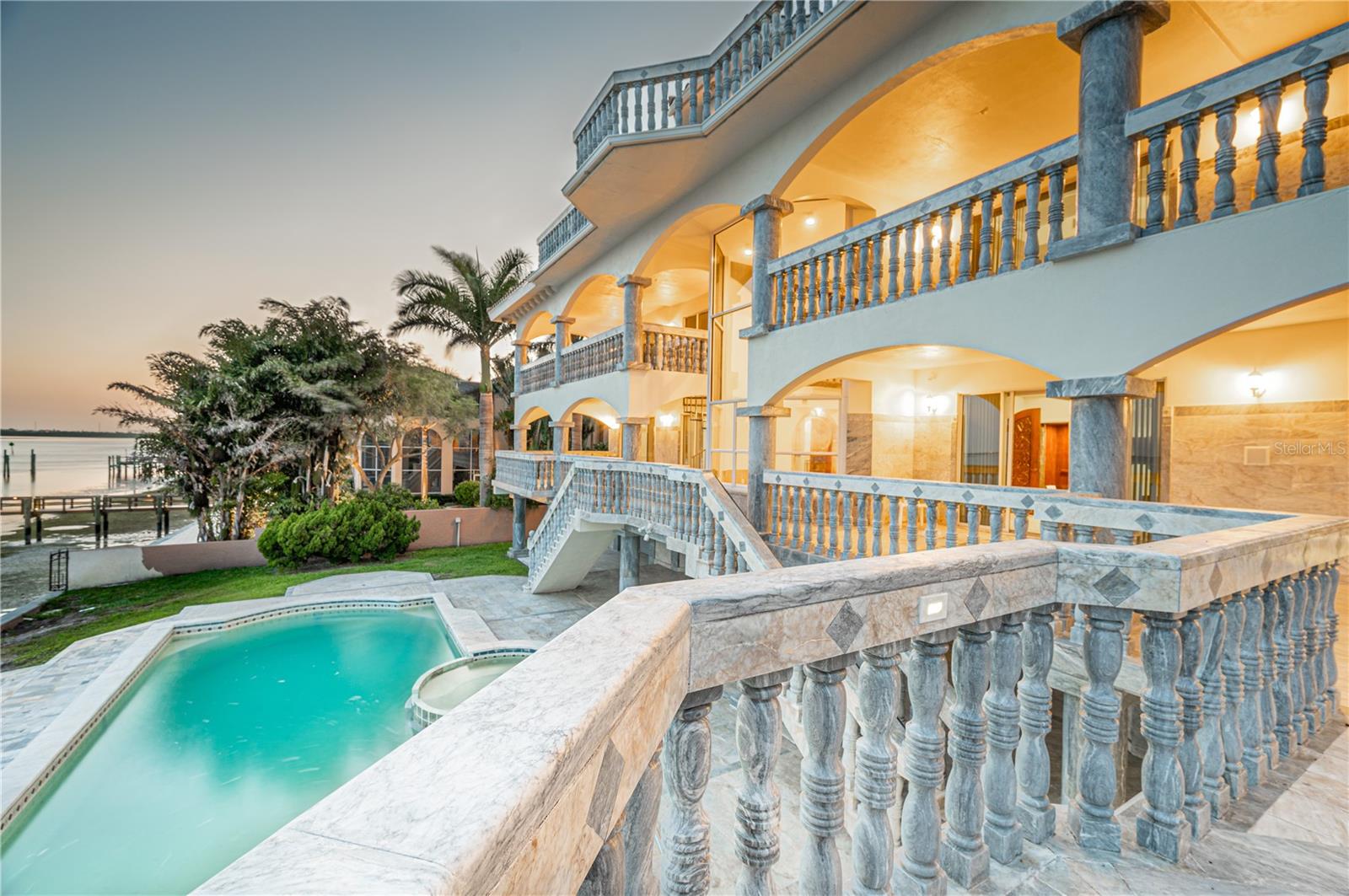 Uniquely Beautiful Masterpiece in Exclusive Bay Way Isles, Florida
This elegantly engineered home is made with concrete and steel, and finished with 325 tons of hand-cut imported marble. Space and elegance take on a whole new meaning in this stunningly conceived and elegantly executed European-designed showplace. This waterfront residence is located in the exclusive guard and gated community of Bay Way Isles II and has a breathtaking panoramic view of Tampa Bay. This three-story home has six bedrooms, and seven and a half baths with curved marble tubs and sinks. The property also boasts three fireplaces, an elevator, a tower office area, leisure room, heated tile pool and spa, imported and hand-carved mahogany doors and a garage that can accommodate 8 vehicles. This home’s main feature is its marble gazebo overlooking the Skyway Bridge—ideal for entertaining. Its ground floor, marble-lined covered patio overlooks the pool and spa area and leads to a private deep water dock. State-of-the-art amenities including a water-cooled air conditioning system, a central vacuum system, and much more. Constructed with concrete floors on all levels including the roof and several thirty-foot precast concrete pilings. Far exceeded coast structure hurricane standard at the time it was constructed which makes this home one of the safest in the area. Conveniently located near the beaches, the golf course, Highway I-75 and Tampa International Airport. This luxury home is truly one of a kind. A must see to fully appreciate.