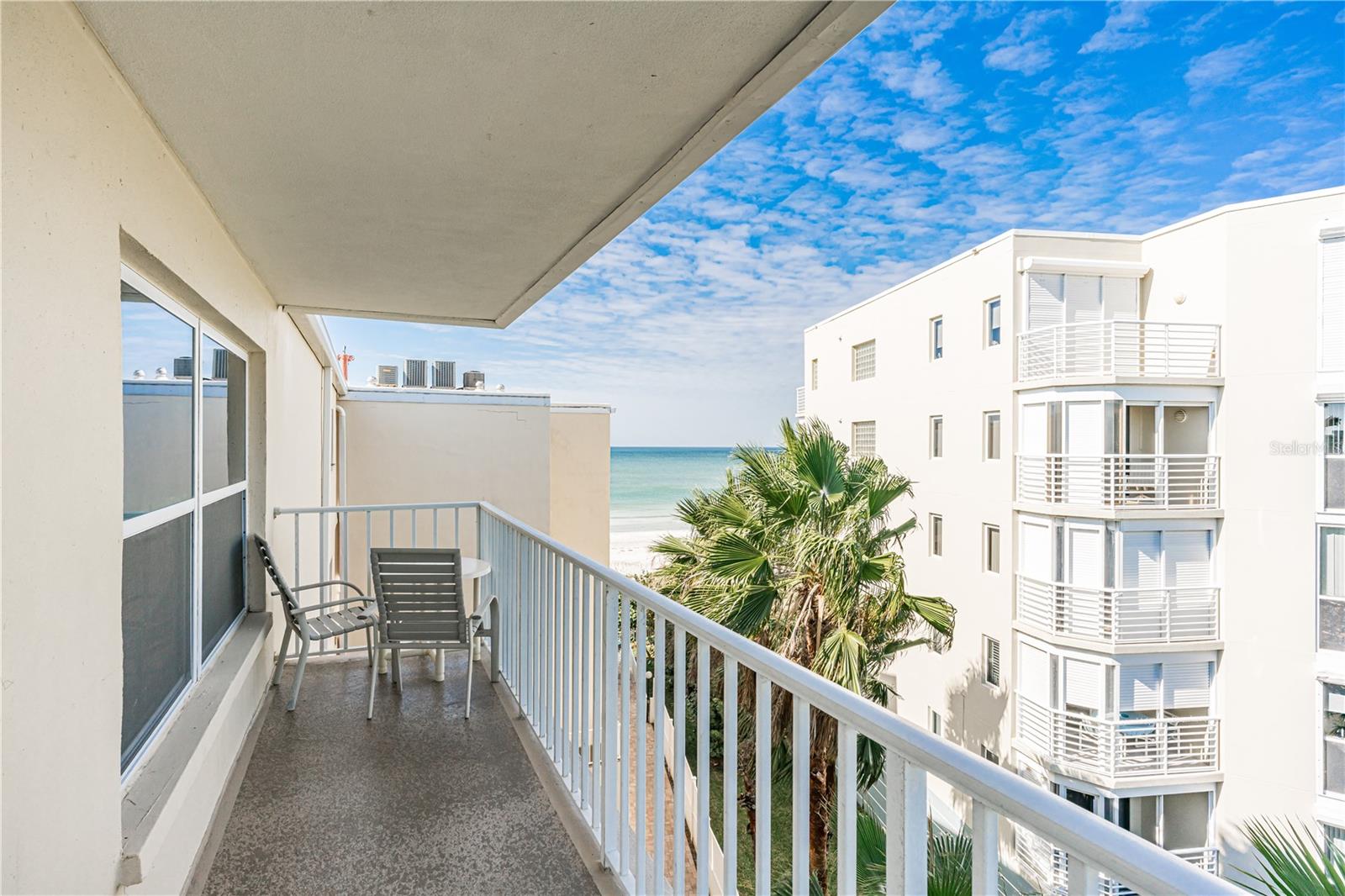 Turnkey, Fully Furnished and Ready to Rent! Welcome to this fantastic top-floor corner condo featuring a wrap-around balcony offering breathtaking views of the Intracoastal Waterway and even a peek-a-boo view of the Gulf of Mexico. This two-bedroom, two-bathroom condo provides the perfect blend of comfort and luxury. The master bedroom invites you to unwind with a plush King bed, complemented by a soothing ceiling fan and a 50" Roku smart TV. Enjoy the convenience of an ensuite bathroom featuring a tub/shower combination. The second bedroom is thoughtfully furnished with both a Queen and Full bed, along with its own ceiling fan and 50" Roku smart TV. Natural light floods the spacious living room, where you can relax and take in the scenic Intracoastal views. A 65" Roku smart TV awaits for your entertainment pleasure. Ceiling fans adorn both the living and dining areas, ensuring a comfortable atmosphere throughout. Prepare
delicious meals in the fully-equipped kitchen, with full-size appliances. Indulge in leisurely swims in the large geothermal heated pool, conveniently located within the property. The pool area features bathrooms and a shower/rinse station for added convenience. For outdoor gatherings, take advantage of the provided grills, including both charcoal and gas options. For your convenience, new HE washing machines (installed in 2020) are available in the coin laundry room on the same floor. As you explore the sugary sand beaches of Indian Shores, keep an eye out for sea turtle nests and skimmer bird colonies, depending on the season. Venture into the quaint town of Indian Shores, where you'll discover charming shops, delectable restaurants, putt-putt golf, and a seabird sanctuary, adding a touch of local charm to your coastal getaway.