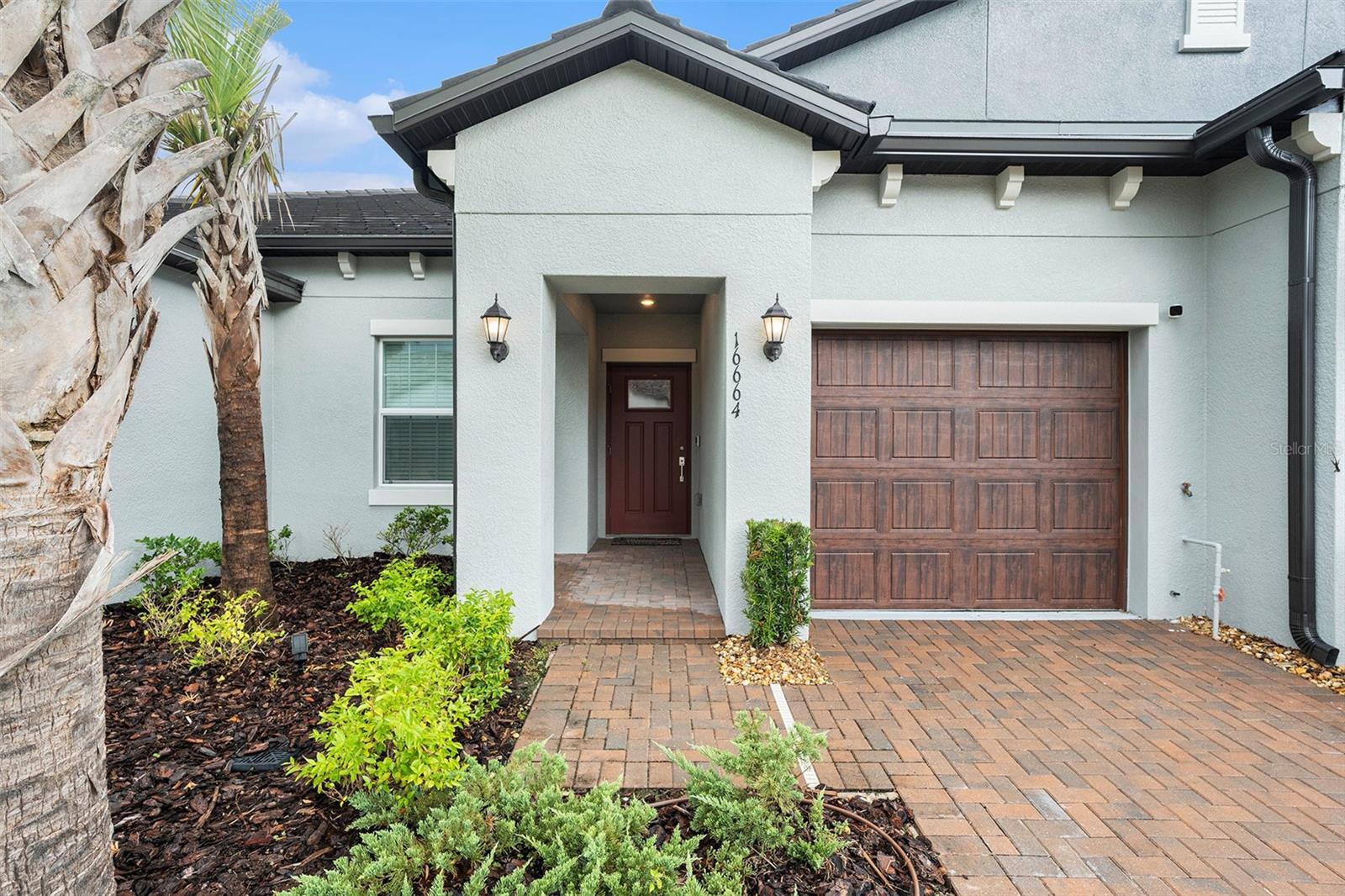 Short Sale. Don't miss out on this move in ready short sale in Angeline. It is under the pricing of new builds the builder is currently offering and has upgrades such as crown molding, kitchen backsplash and a screened back lanai. This modern home has an open floor plan two-bedroom villa featuring a spacious layout that seamlessly connects the living room, dining area, and kitchen, creating a bright and airy ambiance. The large sliding glass door in the living area floods the space with natural light and offers a picturesque view of the conservation area. The master bedroom, which also enjoys this serene tree view comes complete with an en suite bathroom for added privacy and convenience. The villa's back patio is a tranquil oasis, perfect for relaxing or entertaining guests. Don't miss this chance to live in the most innovative 55+ community "Angeline" in Land O Lakes, close to the Suncoast and Tampa. Future Farm and Multi Million Dollar Clubhouse.
Life at Medley means access to exclusive 55+ amenities, including a resort-style clubhouse, state-of-the-art fitness center, six pickleball courts, bocce ball, shuffleboard, a full calendar of events, activities, and entertainment.