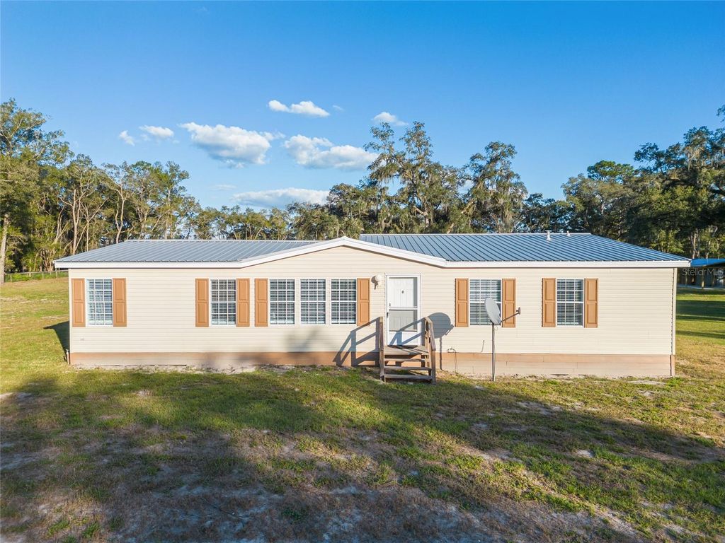 Photo of 3291 SE 188th Terrace, Morriston, FL 32668 (MLS # OM719515)