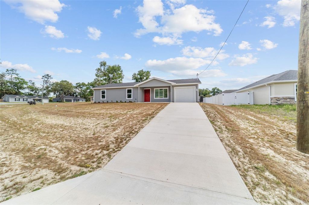 Photo of 13078 NE 7th Loop, Silver Springs, FL 34488 (MLS # OM723655)