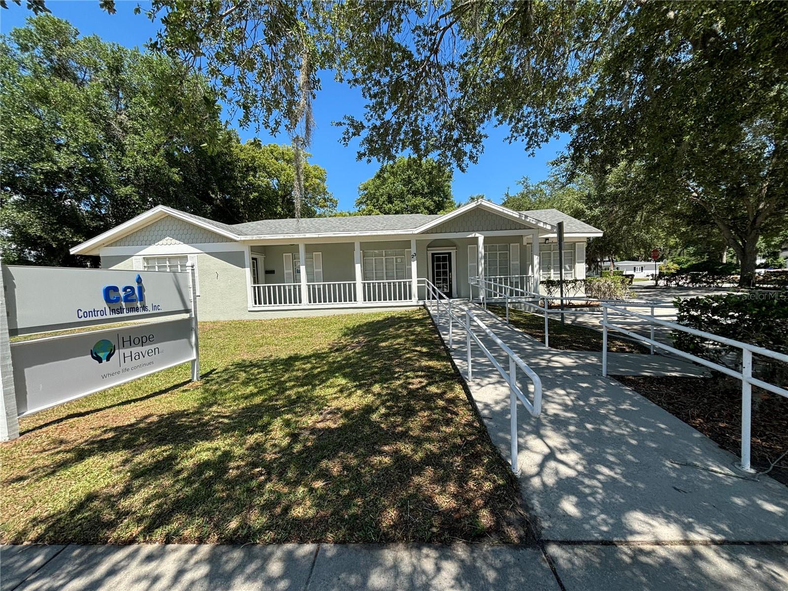 Discover the perfect opportunity to establish or expand your business at 23 S Dillingham Ave, located in the vibrant downtown Kissimmee area. This versatile 2,390 sq. ft. building sits just a short walk from the Osceola County Courthouse, making it an ideal spot for a variety of professional uses. Thoughtfully designed, the property is divided into two office suites, each approximately 1,200 sq. ft., offering maximum flexibility. Side A includes a spacious conference room, four private offices, and a bathroom, while Side B features a conference room, three private offices, and a bathroom. Each suite operates independently, with its own electrical service and HVAC system, ensuring comfort and efficiency. Modern business needs are met with the building’s updated wiring, which is fully equipped to handle today’s phone and internet demands. Beyond its functional interior, the exterior offers practicality with a two-car garage and a designated parking area, making it convenient for both staff and clients. Positioned on a corner lot, the property enjoys enhanced visibility and easy access, providing a strategic location for businesses seeking a prominent presence. Zoned T4-O, this property is suitable for multiple uses, including offices, community residential homes, and passive recreation areas, with options for additional uses like restaurants or retail through a conditional use permit. This flexibility makes it an ideal space for those looking to utilize it as a single large office or maintain the dual setup for different operations. With its prime location, adaptable layout, and modern amenities, 23 S Dillingham Ave. is perfect for businesses looking to expand or establish a new presence in a vibrant, accessible location. Contact us today to schedule a viewing and explore this exceptional opportunity.