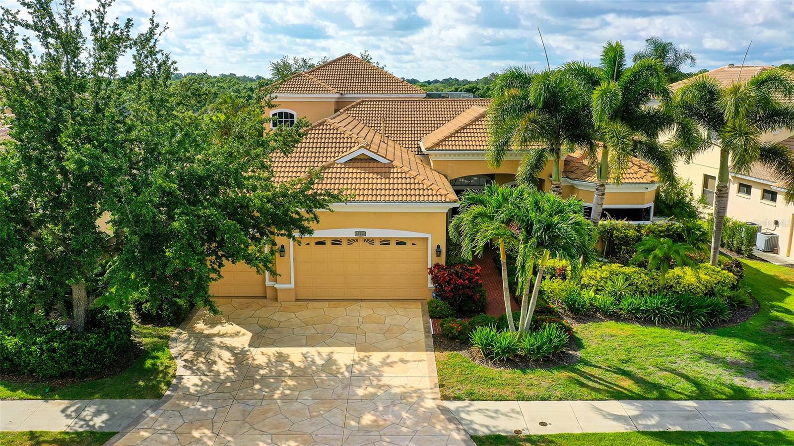 Professionally Decorated, Turnkey Pool Home in the Heart of Lakewood Ranch!
This stunning home is the epitome of style, comfort, and convenience—expertly curated by a professional interior designer and offered completely turnkey. Every element, from the custom window treatments to the tasteful furnishings and accessories, has been selected with purpose and precision. The result? A home that radiates warmth, elegance, and effortless livability from the moment you walk through the door.
Step into a spacious, light-filled foyer that immediately sets the tone for what’s to come. To your right, a cozy den overlooks the screened-in pool and lanai—ideal for morning coffee, quiet reading, or simply relaxing in style. Continue into the open-concept living area where the beautifully appointed kitchen steals the show with its quality finishes, ample cabinetry, and thoughtful layout that makes both cooking and entertaining a pleasure.
The first floor features a split-bedroom plan with a luxurious master suite, a dedicated office, and two additional bedrooms—all with easy access to the private pool area through oversized sliding glass doors. The master suite is a true retreat with elegant décor, abundant natural light, and spa-like finishes.
Head upstairs and you’ll find two more bedrooms, a generous bonus room, and a private balcony with serene views of the pool and the peaceful waterway beyond. Behind the home, a lush wooded preserve adds privacy and natural beauty—your own slice of Florida paradise.
Located in one of the most desirable neighborhoods in Lakewood Ranch, this home offers the perfect balance of upscale living and everyday convenience. You’ll be just minutes from shopping, dining, parks, and top-rated schools—including one of the area’s best middle schools within walking distance. Whether you're a full-time resident or seasonal homeowner, this location checks every box.
Mature landscaping, meticulously maintained, enhances the curb appeal and reinforces the care that has been poured into this property—both inside and out. But what truly sets this home apart is its turnkey nature. Unlike most furnished listings, everything stays (aside from a few personal items). This is not a house that gets stripped bare after the sale—it remains a fully designed, move-in-ready home. Just bring your clothes, your toothbrush, and maybe a bottle of wine to celebrate—you're all set.
Don’t miss this rare opportunity to own a completely move-in-ready home that delivers on luxury, location, and lifestyle. Homes like this don’t come around often—especially not in Lakewood Ranch, one of the nation’s most sought-after communities. Schedule your private showing today and step into a home that’s as extraordinary as the lifestyle it offers.
