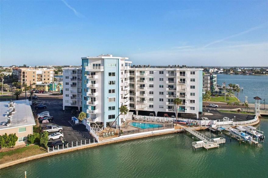 Welcome to this beautiful, bright, and breezy 1-bedroom, 1-bath condo at the desirable St. James Condominium. This rarely available 7th-floor unit offers stunning water views of the Intracoastal and toward the Gulf of Mexico—perfect for enjoying breathtaking sunsets right from your private balcony. Thoughtfully updated, the unit features a renovated bathroom, engineered wood flooring, and elegant plantation shutters. The spacious kitchen offers ample storage, includes granite countertops, a breakfast bar, a separate dining area.

The open and airy floor plan creates a comfortable and functional living space.
You’ll appreciate the abundance of closet space and the additional exterior storage.

 Wake up to peaceful sunrise water views from the primary bedroom—the perfect way to start your day. 
The large balcony is ideal for relaxing while taking in the coastal scenery.

Residents enjoy a wide range of amenities, including a waterfront heated pool, gas grill area, and a lighted 45-foot fishing and boat dock with the option to reserve space for up to 72 hours. Additional features include a fitness room, community lounge, kayak storage, laundry facilities, two secure elevators, guest parking, and a secure building with key fob access. Ideally located just a couple of blocks from the beautiful beaches of Treasure Island Beach and only one block from the vibrant Treasure Island Village with shops and dining. Being sold furnished for your convenience. A fantastic opportunity to own your slice of paradise in Treasure Island—schedule your showing today!