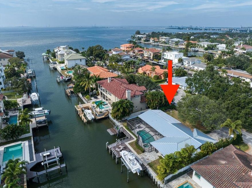 Rare waterfront opportunity to build your dream home on a 9400 sq ft waterfront lot. Located on a deep water canal in Sunset Park and just five houses from the open-bay with easy access to the Gulf of Mexico. This property comes equipped with a multi-landing Trex Transcend Composite deck, under-dock LED lights, a wet slip that accommodates a 43’+ boat, 50-amp electric service, a 14,000 lbs 4-post beam lift, a 1,500 lbs boat and kayak elevator lift, and a newer seawall and cap with steel reinforcement to allow for a future 18’ curb if desired. Being sold for land value only, this property measures 100'x94' and is zoned for the Mabry/Coleman/Plant school district.