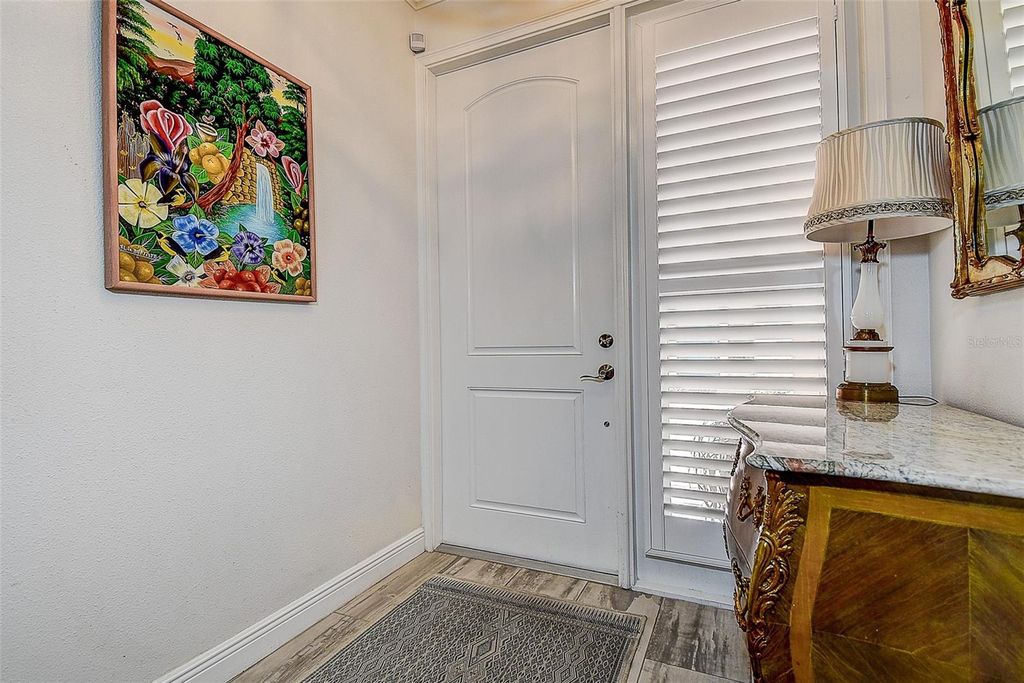 Photo of 411 Regent Lane N, St Petersburg, FL 33701 (MLS # TB8472337)