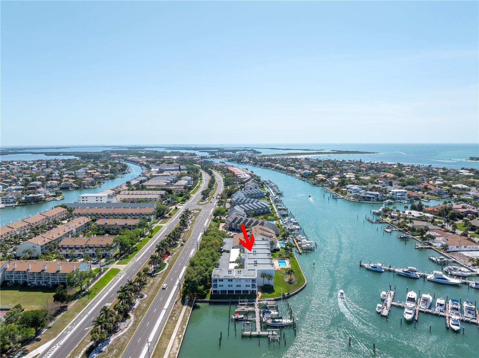 Endless potential and stunning water views await in the Yacht Haven community of Tierra Verde!
This spacious 2 bedroom, 2 full bathroom waterfront condo with a boat slip and lift offers a rare opportunity to create your ideal coastal retreat. Step inside and you're greeted by the kitchen, which opens into the dining area accented by classic Saltillo tile flooring and a wood-accent wall that adds character and warmth. Just beyond, the living area features vinyl plank flooring and large sliding glass doors that fills the space with natural light and lead to a private balcony overlooking the Tierra Verde Grand Canal. Perfect for morning tea or enjoying the breathtaking sunsets. The thoughtful split floor plan places the guest bedroom and full guest bathroom toward the front of the unit, offering comfort and privacy for visitors. Tucked away at the back, the primary suite serves as a peaceful retreat with its own balcony access, a walk-in closet, and an updated en-suite bath. A standout bonus is the approx 600 sq ft ground-floor, cabana-style flex space (non-heated), which includes an enclosed area with sliding glass doors leading to a screened lounge space and an open-air deck just steps from the pool. Perfect for hobbies, storage, or simply unwinding by the water.
Yacht Haven is a boater’s dream, featuring a heated pool, lush mature landscaping, Port 32 Marina Tierra Verde right across the canal with a fueling station for quick access to the Gulf and just minutes from shopping, dining, and some of the best beaches the Gulf Coast has to offer. Whether you're seeking a weekend escape, a renovation project, or full-time waterfront living, this is your chance to create something truly special.
Bring your vision; waterfront living starts here.