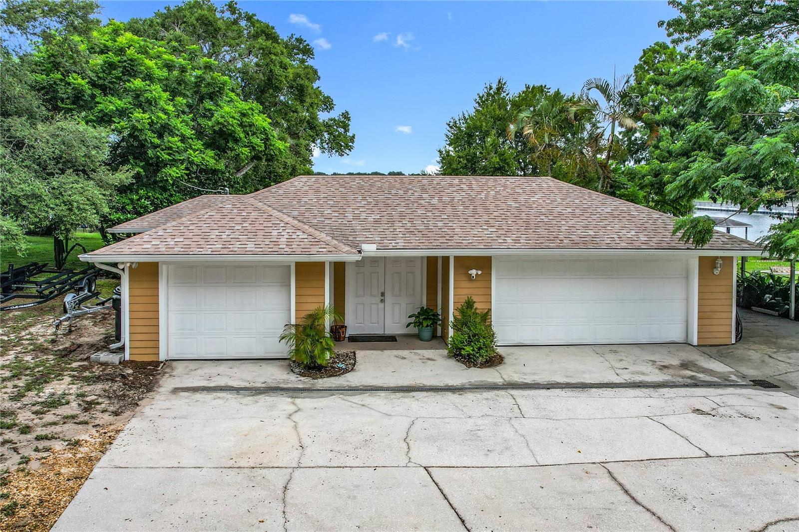 CHAIN OF LAKES POOL HOME!
Timeless Elegance Meets Modern Comfort on the South Chain of Lakes
Welcome to your lakeside sanctuary in the heart of Winter Haven. This beautifully updated, move-in ready home blends the charm of its heritage with the modern features and peace of mind today's homeowners expect. Perfectly positioned on the desirable South Chain of Lakes—and not in a flood zone—this single-level home offers serene water views through expansive windows and easy, everyday luxury in every corner.
Since April 2024, the home has undergone extensive updates, including:
New HVAC system and ductwork
New 1,000-gallon septic tank and five-chamber drain field
Full PEX re-piping throughout
French drain across the full width of the driveway
New flooring, fresh paint, and updated trim throughout
New jet ski dock, new boat lift motor and cradle for a pontoon boat
Refreshed pool system for effortless maintenance
Every room in this home is thoughtfully designed and purpose-driven:
The primary master suite is quietly tucked away for maximum privacy and tranquility.
A second master suite features its own en-suite bath, walk-in closet, and private access to the pool area—ideal for guests or extended family.
The outdoor shower near the pool adds convenience and a resort-like touch.
At the center of the home, the spacious living room is made for entertaining, complete with a real wood-burning fireplace and six sets of back doors that open to the lanai, creating seamless indoor-outdoor flow.
The kitchen is as functional as it is beautiful, with custom cabinetry, solid surface counters, a new modern sink, dishwasher, disposal, and refrigerator—a dream for any home chef.
The sunroom, surrounded by windows, offers daily, year-round views of the lake and pool—providing the kind of peace and beauty only found in Central Florida.
But this home doesn’t just impress inside. Step down into your completely private courtyard, a hidden oasis framed by swaying palm trees—ideal for quiet sunbathing or peaceful reflection. A thoughtfully designed walkway connects the courtyard to the front door, offering a grand yet intimate entry.
The property also includes two separate garages (offering three-car storage) plus a dedicated carport—ample space for vehicles, lake toys, and more.
This is more than a home—it’s a private retreat, a lakeside lifestyle, and a rare opportunity all in one.
Come experience why this one-of-a-kind Winter Haven property is exactly why we choose to live in Florida.
We highly recommend scheduling tours after 8:00 PM to fully take in the breathtaking sunset, best experienced from the tranquil elegance of the poolside retreat.