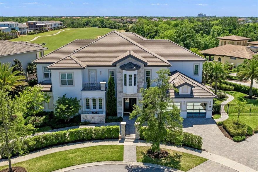 Under contract-accepting backup offers. If you are looking for two of the most iconic homesites in arguably the BEST LOCATION in Reunion Resort look no further!  This exquisitely finished 8 BR CUSTOM BUILD inside the exclusive gates of the Bear's Den adjacent to Traditions Clubhouse will fulfill every desire.  This home makes an immediate statement from the soaring 25' Porcelain tiled Grand Foyer entryway and Custom Mural adorned walls through to the Great Room and Kitchen on your way to the huge back expanse of this DOUBLE LOT with its INFINITY EDGE POOL and BREATHTAKING VIEWS this home will continually AMAZE!  Situated at the head of the Bear's Den with a South facing exterior this home is BATHED IN SUN throughout the day.  The covered Lanai and its built in INFRARED HEATERS pulls you out to a vast gathering area and chefs Summer Kitchen and acts as a seamless extension of the Great Room elegance you just left.  Whether its lounging in the pool or sunbathing on the huge travertine covered deck, the additional play areas serve as a great preamble to the incredible green space and beauty the 18th hole of Jack Nicklaus Traditions course provides.  As you enter  the home the upgrades are everywhere!  Cantera doors, Porcelain tile, Exquisite Paneled Wood work, Vaulted Ceilings with Architectural Elements, Mural Walls and Custom Draperies, Sub Zero and Wolf Appliance package, Control 4 Media and Lighting controls throughout not to mention the ability to create your own environment with the custom sound system and speakers  situated through the home and Professionally Designed by one of Reunion's top interior designers!
  The first story offers a Single Master Bedroom with convenient walk out access to the pool area.  As you continue down to opposite end of the  one whole wing of the home has been dedicated to endless opportunities.  Whether you want to take in a show in the formal starlit MOVIE THEATER or test your golf skills in the GOLF SIMULATOR or just relax with family in friends playing a game of pool, this media room even offers access to the pool area directly or via the pass through bar.  The home even offers a fully stocked Gym that rivals some fitness centers if you want to work your body on the vacation to fight off many of the great meals you would undoubtedly have in the Gourmet Kitchen. If any of these activities tire you out or you just want to unwind, then the state of the art SPA ROOM will provide the relief you seek.  Outfitted with a beautiful Sunken Hot Tub, Fully Jetted shower and a Dry Sauna along with a fully stocked wet bar and HEATED LOUNGERS this room might become your favorite in the home!  
   For work or rest you will enjoy the Grand Staircase up to the second floor office and adjoining 7 Ensuite  bedrooms.  This includes the incredible Master that's wonderfully fitted with a duel LED Jetted Shower experience, huge walk in closet and Drop Down Movie Screen hidden into the ceiling as well as access to the Grand Balcony.  Sharing access with 4 other Bedrooms, this Balcony offers even better sweeping views of your surroundings as you gaze over the pool area onto the 18th hole. 
  As mentioned this home is conveniently adjacent to Traditions Clubhouse and its Bar, Restaurant and Fitness Center.   You are also mere steps away from the Nicklaus golf practice facility and Clubhouse as well as a gated Private Park for all that offers a 1/4 mi walk, sand volleyball and chipping green.  Come and see this one of a kind Estate and the Best Reunion offers!