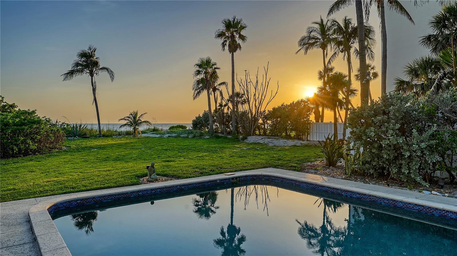 Nestled along the pristine shores of Longboat Key, this furnished, direct Gulf-front getaway offers an exceptional beachfront lifestyle and modern updates. With the beach in your backyard, this rare mid-Key offering captures breathtaking sunsets and mesmerizing water views from nearly every room. Thoughtfully updated, the nearly 3,000-square-foot, two-story residence features engineered wood flooring, impact-rated windows and French doors, storm shutters, and a reimagined gourmet kitchen. The open-concept main level is designed for effortless indoor-outdoor living, where the Gulf-front living room seamlessly flows into the dining area with a fireplace and a chef’s kitchen. A culinary retreat boasting an expansive island with breakfast bar, marble countertops, stylish tile backsplash, and top-tier stainless steel appliances, including a Wolf gas range, Sub-Zero refrigerator, and Miele dishwasher. Custom cabinetry provides abundant storage, ensuring both function and beauty. Two guest suites, positioned on opposite ends of the main floor, offer enhanced privacy for visitors. A gracefully winding staircase leads to the upper level, where the Gulf-front primary suite serves as a serene sanctuary. Wake up to uninterrupted water views and indulge in the spa-like en-suite bathroom featuring marble finishes, dual vanities, and his-and-her walk-in closets. A third guest suite completes this level, offering comfort and privacy. Outside, enjoy pavered walkways framed by wrought-iron gates, two-car garage, and Gulf-front pool deck designed for relaxation and entertaining. Step directly onto the sandy shores and into the tranquil waters of the Gulf of Mexico, embracing the ultimate Longboat Key lifestyle. Ideally situated on mid-Longboat Key, this home is moments from championship golf and fine dining at Longboat Key Club, boutique shopping, and the cultural attractions of St. Armands Circle and downtown Sarasota. Whether seeking a primary residence or a coastal escape, this rare Gulf-front gem delivers an unparalleled experience in one of Florida’s most sought-after destinations.