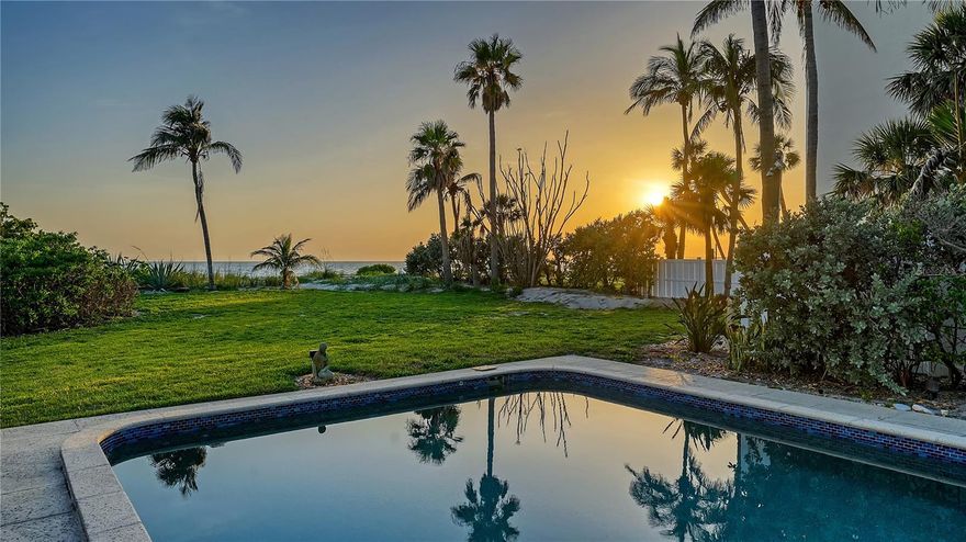 Nestled along the pristine shores of Longboat Key, this furnished, direct Gulf-front getaway offers an exceptional beachfront lifestyle and modern updates. With the beach in your backyard, this rare mid-Key offering captures breathtaking sunsets and mesmerizing water views from nearly every room. Thoughtfully updated, the nearly 3,000-square-foot, two-story residence features engineered wood flooring, impact-rated windows and French doors, storm shutters, and a reimagined gourmet kitchen. The open-concept main level is designed for effortless indoor-outdoor living, where the Gulf-front living room seamlessly flows into the dining area with a fireplace and a chef’s kitchen. A culinary retreat boasting an expansive island with breakfast bar, marble countertops, stylish tile backsplash, and top-tier stainless steel appliances, including a Wolf gas range, Sub-Zero refrigerator, and Miele dishwasher. Custom cabinetry provides abundant storage, ensuring both function and beauty. Two guest suites, positioned on opposite ends of the main floor, offer enhanced privacy for visitors. A gracefully winding staircase leads to the upper level, where the Gulf-front primary suite serves as a serene sanctuary. Wake up to uninterrupted water views and indulge in the spa-like en-suite bathroom featuring marble finishes, dual vanities, and his-and-her walk-in closets. A third guest suite completes this level, offering comfort and privacy. Outside, enjoy pavered walkways framed by wrought-iron gates, two-car garage, and Gulf-front pool deck designed for relaxation and entertaining. Step directly onto the sandy shores and into the tranquil waters of the Gulf of Mexico, embracing the ultimate Longboat Key lifestyle. Ideally situated on mid-Longboat Key, this home is moments from championship golf and fine dining at Longboat Key Club, boutique shopping, and the cultural attractions of St. Armands Circle and downtown Sarasota. Whether seeking a primary residence or a coastal escape, this rare Gulf-front gem delivers an unparalleled experience in one of Florida’s most sought-after destinations.