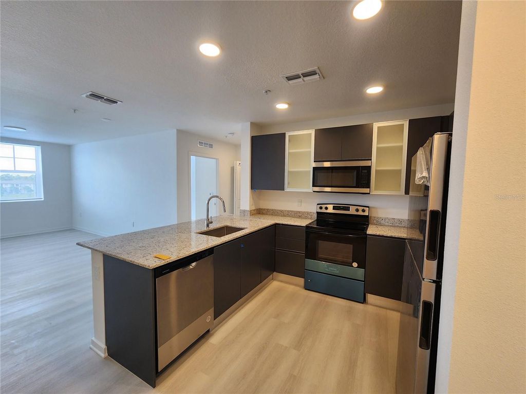 Photo of 5579 Millenia Park Blvd #507, Orlando, FL 32839 (MLS # O6408716)