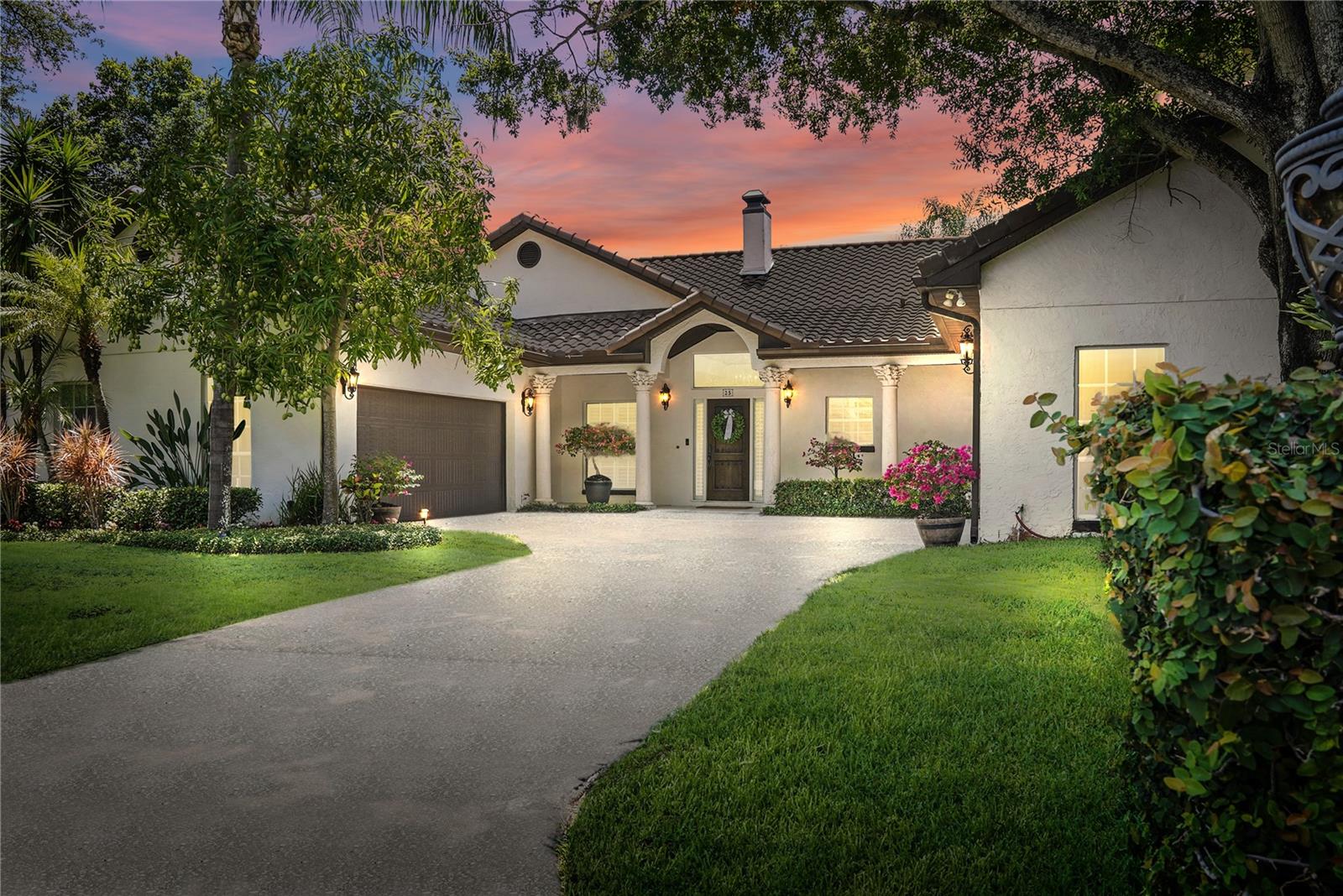 Back on market due to buyer's financing so don't miss your chance to acquire one of the best waterfront lots in Beach Park! Locals call it “The Treasure” for a reason. Located on the cul-de-sac of Treasure Drive—one of the most coveted waterfront streets in Beach Park—this charming Spanish Colonial sits on an oversize 90 X 130 lot and offers open water views of Tampa Bay, the St. Pete skyline, and one of Tampa’s best kept secrets, secluded Pirate’s Cove. It is extremely rare for a house on the west side of Treasure to become available. The neighbors on this street are absolutely wonderful and truly look out for one another. There is a strong sense of community on this street and in this neighborhood. Build your dream home or take advantage of what this happy home has to offer. The floorplan in this 4,020 square foot property is fantastic, with four bedrooms and bathrooms all located on the first floor. The formal living room has a wood burning fireplace and is open to the formal dining and family room, featuring vaulted ceilings. The kitchen has a chef’s gas range and a window over the sink with a water view. The house features two bonus rooms, one downstairs and one upstairs. The first floor bonus room, which is connected to two of the bedrooms, has 2 closets and can be used as a study, playroom or a second living room. The upstairs bonus room is very spacious and can be used as a media room, large playroom, office, or a 5th bedroom and has an attached full bath and balcony that overlooks the pool and Tampa Bay. Master suite has French doors that lead out to the pool, an en-suite bath, a huge walk-in closet and is connected to a large room with two doors that can be used for an office, gym, nursery or transformed into a second closet of your dreams. The 1st floor guest bedroom can also be used as an office and has an attached full bath. There are two, 2-car garages, so you can fit 4 cars. On the left side of the house is a Chicago brick driveway that provides additional parking for an RV, boat and trailer, or at least 3-4 more cars. The backyard is private and tranquil, with stunning water views, a protected dock, and covered 10,000 lb. boat lift. Want to take your boat to St. Pete for lunch or dinner? You will be there in 20 minutes. There are also 2 traffic lights in this neighborhood that help with safety while driving, and Treasure Drive offers you a back route to the Howard Frankland Bridge to St. Pete, the Courtney Campbell Causeway to Clearwater, and the Veteran's Expressway to North Tampa. Pick mangoes off not one, but two of your mango trees on the property and make fresh smoothies and margaritas. Sit on your dock and watch dolphins and manatees swim by daily. This home is in an A rated public school zone (Grady, Coleman & Plant) and is close to local shops, dining, private schools, and Tampa International Airport. Location is everything. If you want to move to one of the best waterfront streets in Beach Park, in one of the best neighborhoods in Tampa Bay, now is the time.