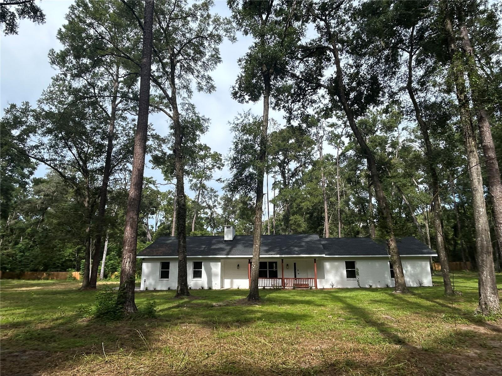 Luxury Living on 2.5 Acres in Jonesville's Exclusive Estate Community!
Discover the perfect blend of modern luxury and serene country living in this completely renovated 3 bedroom, 2 bathroom home nestled on a spacious 2.5-acre lot in the heart of Northwest Gainesville/Jonesville. Enjoy ample space and privacy, offering a peaceful escape from the hustle and bustle.
Step inside and be captivated by the light-filled living room and kitchen, boasting soaring vaulted ceilings that create an expansive and airy atmosphere. The gourmet kitchen features exquisite solid surface countertops and sleek stainless-steel appliances. Throughout the home, elegant crown molding adds a touch of sophistication to each room.
Relax and entertain in the versatile bonus room, perfect for a game room or media room, offering endless possibilities for enjoyment. Unwind on the large screened back porch, overlooking your private backyard and the tranquility of nature.
A sizable shed with a new metal roof provides a fantastic opportunity for a workshop or convenient storage for lawn equipment, adding functionality and value to this exceptional property.
Key Features:
Completely Renovated 3 Bedroom, 2 Bathroom Home
Sprawling 2.5-Acre Lot
Vaulted Ceilings in Living Room and Kitchen
Solid Surface Countertops & Stainless-Steel Appliances
Elegant Crown Molding
Versatile Bonus Room
Large Screened Back Porch
Private Backyard
Sizable Shed with New Metal Roof
Situated in a quiet, farm-friendly area of Northwest Gainesville, this home offers easy access to shopping, great schools, and great commuting.
Don't miss this chance to experience the best of Gainesville living!
Schedule your private tour today!
Pets considered on a case-by-case basis.