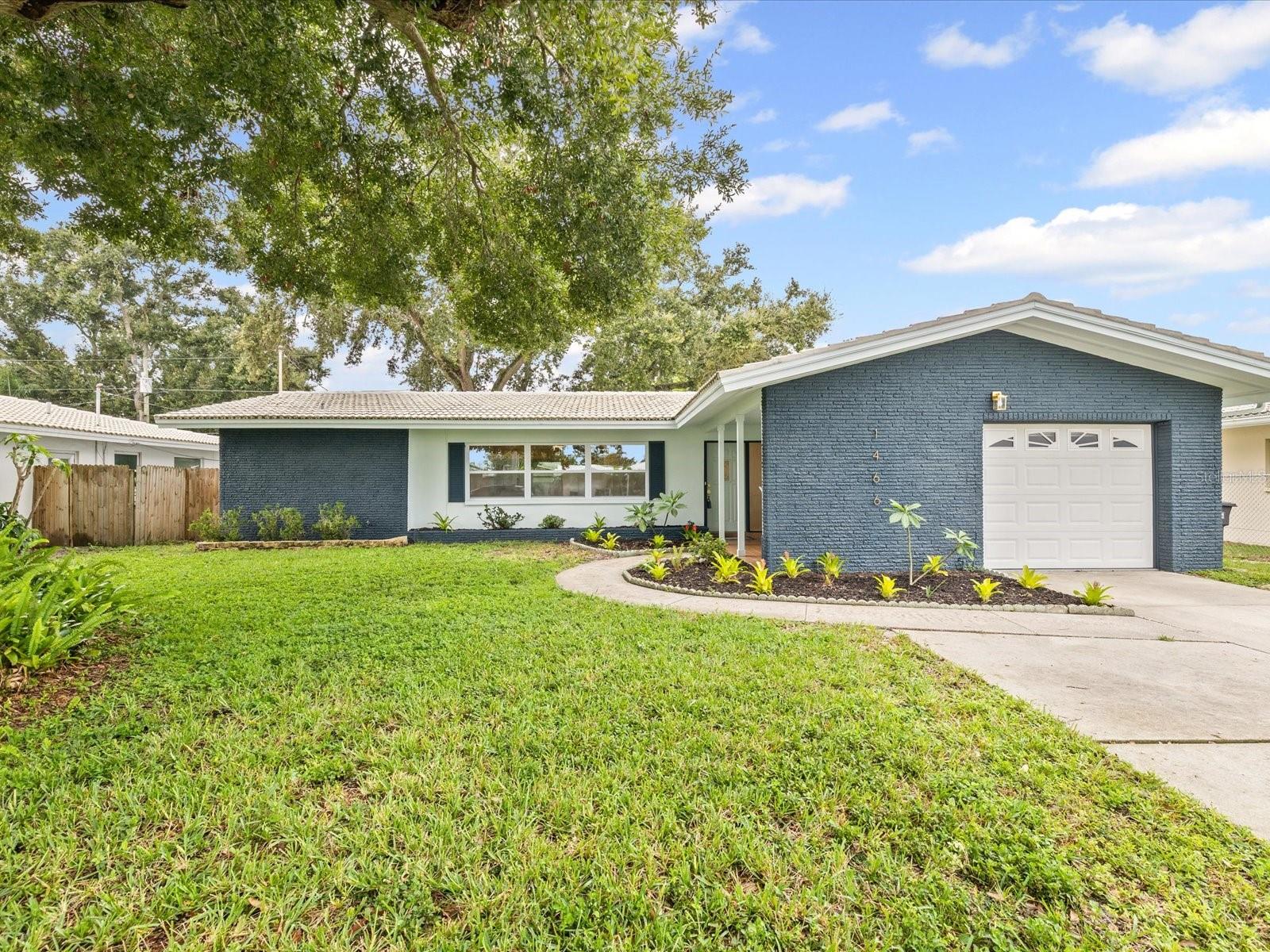 Welcome to your dream home in the heart of Clearwater! This completely renovated 3-bedroom, 2-bath residence is located in the highly sought-after Imperial Park neighborhood — just a short walk to A-rated Plumb Elementary and minutes from world-renowned beaches, top restaurants, shopping, and major airports. Best of all, it’s situated in a non-flood zone for added peace of mind. Step inside to discover a thoughtfully designed split floorplan featuring two spacious living areas, a large dining area, and a versatile flex-space nook ideal for a study area or dry bar. The home boasts stunning modern finishes, including new waterproof flooring throughout, and a chef-inspired kitchen with quartz countertops, custom cabinetry, high-end stainless steel appliances, and a designer farmhouse sink. The oversized primary suite offers a tranquil retreat with a large walk-in closet and a luxurious en-suite bathroom complete with dual vanities and a deluxe shower tower featuring a rainfall showerhead and eight massaging jets. Just off the primary suite, step out onto your private deck — the perfect spot for morning coffee or quiet relaxation. The two guest bedrooms are generously sized and share a beautifully updated bathroom with a bathtub — ideal for families. The second living area spans nearly 400 sq ft, making it perfect for a home office, playroom, or media space. Enjoy Florida living outdoors with a large backyard and wide side yards — plenty of room for a pool or future expansion. Additional updates include new windows, updated plumbing, newer ductwork, efficient lighting, and a new water heater. Imperial Park is a premier Clearwater community known for its walkability, friendly neighbors and central location. Don’t miss this rare opportunity to own a move-in-ready home in one of Clearwater’s most desirable neighborhoods!