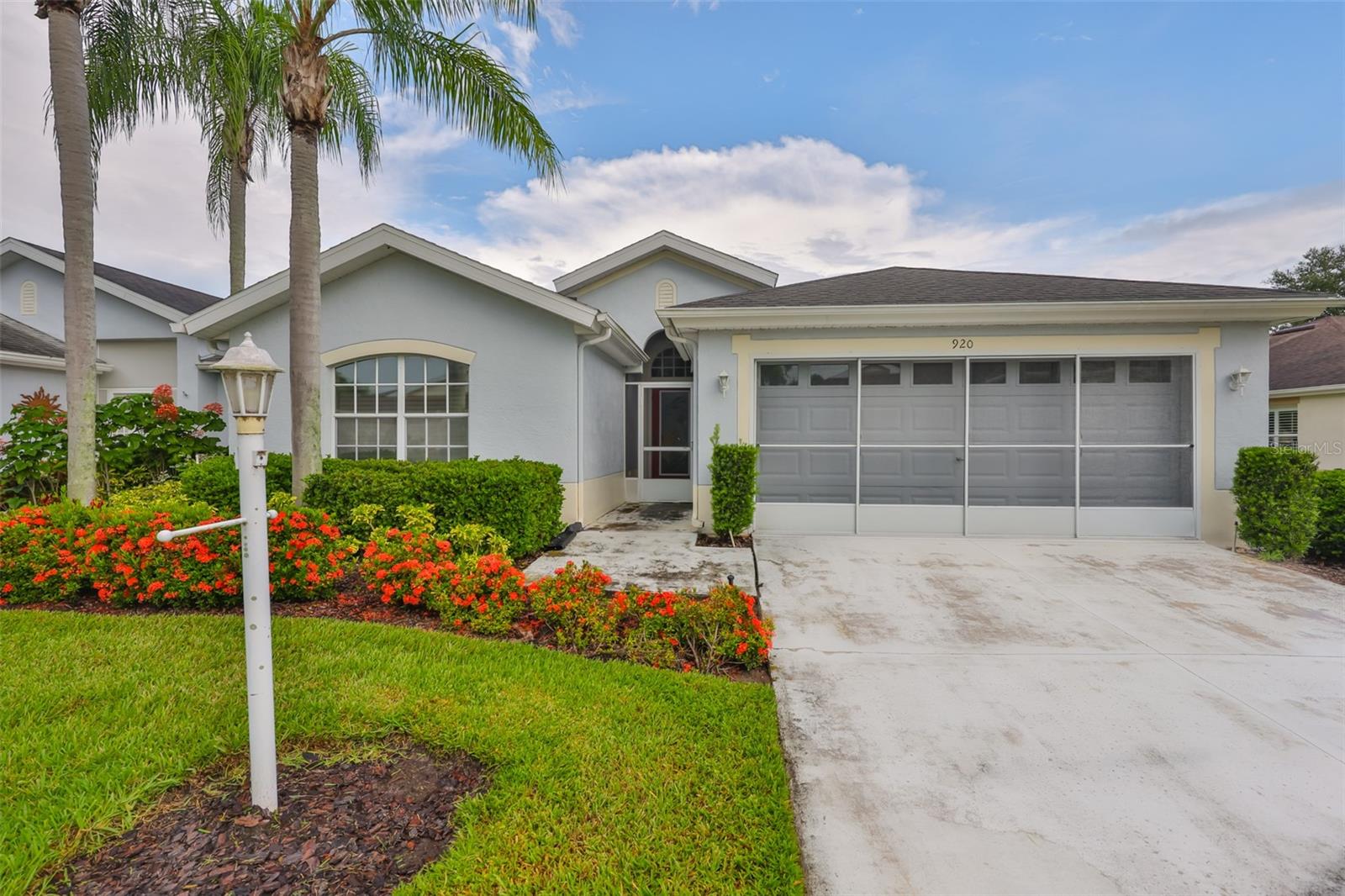 This Dartmouth model condo is centrally located with quick access either by car or golf cart to both the north and south clubhouses. Each features indoor and outdoor pools, spas, exercise areas, arts and crafts, and party rooms. The north also includes a cafe and large auditorium with a stage for various entertainment including movies and live performances The south includes a restaurant and bar. Other activities include: golf, pickle ball, tennis, lawn bowling, bocce courts and much more.
Upon entering your condo, your tiled foyer leads directly to the large great room with a formal dining area and a huge living area. On the left will be the entrance to the guest bedroom and bath and than a bonus room with a stunning built in work area.
Off the living area is the split primary bedroom with a large walk-in closet and additional reach in closet. The bathroom includes dual sinks, large walk-in shower and a water closet. Sky lights are located in the living area and bonus room. Your kitchen area has a large breakfast nook that also has a slider door leading to the enclosed lanai with access door to the outside. The updated kitchen has newer counters with back splash tile. Your double sink includes a fresh drinking water faucet and a spray faucet. Your water comes from a reverse osmosis system with a large water softener located in the garage which serves the whole house. The chef of the house will appreciate the updated kitchen appliances including built in microwave. Notice the two inch blinds in the kitchen and Roman cloth blinds elsewhere in the condo. Before entering the garage from the kitchen, you pass the pantry and utility area for for hookup to a washer and dryer. Finally enjoy the near by white beaches of the gulf coast, professional sports, cruise lines and Disney World.