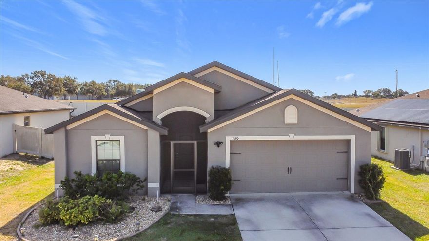 Welcome to this well-maintained single-family home located at 1899 Amber Sweet Cir in Dundee, Florida, offering a comfortable and functional layout designed for modern living. Built in 2019, this residence features an open-concept floor plan with spacious living and dining areas, a well-appointed kitchen with ample cabinetry and counter space, and generously sized bedrooms that provide flexibility for a variety of lifestyles. The primary suite offers privacy and convenience with an en-suite bathroom and walk-in closet, while additional bedrooms allow for guest space, home office use, or hobbies. Situated on a quiet residential street within a growing community, the property provides easy access to everyday conveniences, shopping, and dining. Nearby options include Dundee Ridge Plaza, Winter Haven shopping centers, and local restaurants such as Floridino’s Italian Kitchen, Mirtha’s Latin Café, and popular national dining options along US-27. Outdoor enthusiasts can enjoy proximity to local parks, lakes, and natural areas, including Allen David Broussard Catfish Creek Preserve State Park. The location offers convenient connectivity to Winter Haven, Haines City, and Lakeland, with access to major roadways for commuting throughout Central Florida. Winter Haven Regional Airport and Lakeland Linder International Airport are within a reasonable driving distance, and Orlando area airports are accessible for domestic and international travel. This property presents an excellent opportunity to own a move-in-ready home in a desirable Central Florida location with access to shopping, dining, recreation, and transportation.