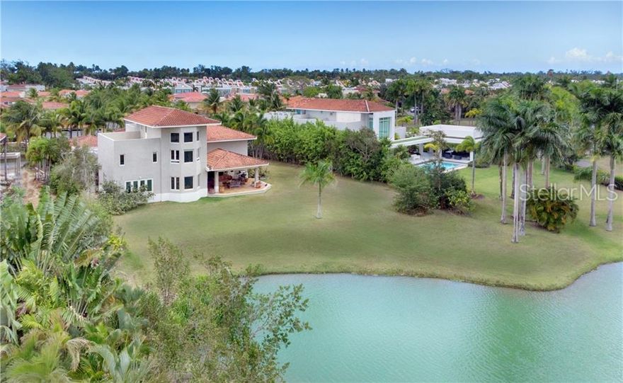 ***UNDER CONTRACT***

This single-family home is located in one of the most sought after gated communities in Puerto Rico, Ritz Carlton Dorado Beach Resort. 406 Dorado Beach East enjoys an open floor plan, double height living room, gourmet kitchen, dining, and guest suite on first level. The upper level has 3 bedrooms with en-suite baths, with master bedroom loft affording private office with its own terrace. Views abound, this property including pond, golf course and mountains in the distance all make this home a rare find within this exclusive community.