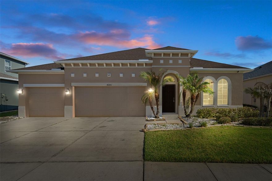 Step into the lifestyle you’ve been waiting for in the highly sought-after Seven Oaks community. Tucked behind a private, gated entrance, this impeccably cared-for 2012 single-story home delivers the perfect blend of elegance, comfort, and Florida charm. From the moment you arrive, lush tropical landscaping and a spacious three-car garage set the tone for what’s inside.
As you enter, you’re welcomed by soaring ceilings and a thoughtfully designed open-concept layout that immediately draws your eye to serene water and conservation views beyond. Just off the foyer, a stylish office or den with French doors offers the ideal space for working from home or quiet retreat. The heart of the home flows effortlessly into light-filled living areas, making everyday living and entertaining feel effortless.
Slide open the doors to your private lanai and take in peaceful water views and the beauty of the surrounding conservation—on select mornings, you may even catch colorful hot air balloons drifting across the sky. With an expansive backyard, there’s plenty of room to create your own outdoor oasis, whether that’s a pool, garden, or extended entertaining space.
Inside, you’ll find a host of upgrades throughout, including an oversized owner’s suite, high ceilings, 42-inch maple cabinetry, Whirlpool stainless steel appliances, and refined finishes at every turn. A whole-house Rain Bird irrigation system adds convenience, and the exterior was freshly painted in October 2020—offering true move-in-ready peace of mind.
This meticulously maintained four-bedroom, three-bath home truly checks every box. Beyond your front door, Seven Oaks elevates daily living with miles of walking and biking trails, abundant wildlife, a vibrant clubhouse, three pools including a resort-style pool and splash pad, fitness center, sports courts, ball fields, playgrounds, café, and exclusive resident events. Perfectly located in the heart of Wesley Chapel, you’re just minutes from top-rated schools, shopping, dining, medical facilities, and more.
This is more than a home—it’s the lifestyle buyers are searching for.