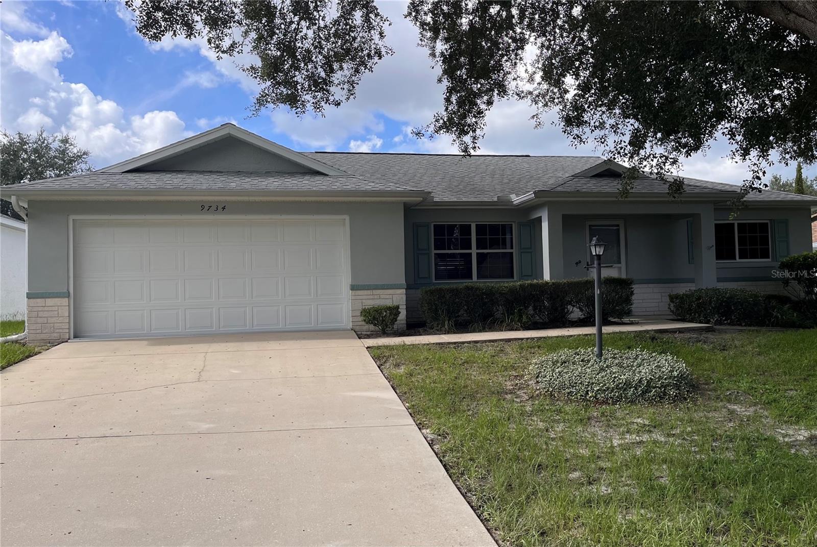 Spacious Granada II Model Single Family Home located in the Crescent Ridge Neighborhood of On Top of the World. This MOVE-IN READY home has been freshly painted and comes completely turnkey! ROOF 2020 & HVAC 2009 (recently reconditioned and maintained regularly). This home has 2 bedrooms, 2 bathrooms and a 2-car garage with workshop space. The eat in kitchen has a cut out that opens to the great room and a brand-new refrigerator. Beyond the great room is an expanded area that can be used as a den or office. A spacious Florida room with slider windows was added on that step out to a covered porch and a back yard that has privacy fencing grandfathered in. Vinyl plank flooring throughout the bedrooms and great room. The primary bedroom has an ensuite bath with a newer toilet with bidet. and walk-in closet. Across from the golf course this maintenance free area of On Top of the World is serene with mature landscaping and minimal traffic. On Top of the World is Ocala's premier, gated, active 55+ community, loaded with amenities, including golf cart access to 2 shopping centers.