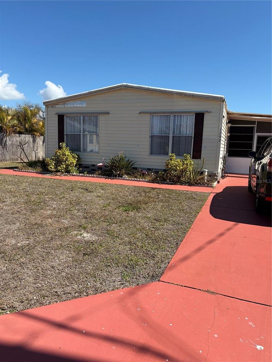 Great opportunity to get into a canal front property with access to Lemon Bay and the Gulf of America.  This is a good sized double wide home featuring 2 large bedrooms and 2 baths.  Also included is living, and dining, kitchen with breakfast nook, Florida room and lanai.  Laundry is off the lanai in the first of 2 sheds.  Home is on a salt water, brackish canal with dock and davits, and a fenced in dog run.  This home does
require TLC which the price reflects.  Great central location, close to shopping, dining and beaches.