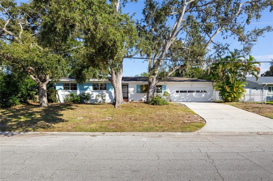 Step back in time and fall in love with this vintage Dunedin charmer in Fairway Estates—one of the community’s most beloved neighborhoods. Built in 1957 and lovingly cared for by the same family since 1963, this home captures the warmth, character, and craftsmanship of a bygone era. If you’re tired of cookie-cutter remodels filled with gray flooring and all white cabinets in the kitchen & baths, this is your chance to own a true classic that offers timeless style and incredible potential.
Move right in and enjoy the home’s many well-maintained features, then update at your own pace to suit your taste and lifestyle. The freshly painted exterior and interior create a bright, welcoming feel, while large windows flood every room with natural light. Each of the three bedrooms is a corner room with windows on two sides, creating an airy sense of space. Gorgeous original wood flooring runs through much of the home—rich in character and in excellent condition.
Unlike most homes in Fairway Estates, this one was built with a raised crawl space foundation—an uncommon and desirable feature that provides easy access to plumbing and electrical systems, enhanced air circulation under the home, and a cooler, drier environment indoors during Florida’s humid months. It’s one of those subtle construction details that reflects thoughtful mid-century design and long-term practicality.
The spacious two-car garage includes a convenient half bath, ideal for rinsing off after a day at the beach or tending the garden. The large, pool-sized lot is fully fenced, offering privacy and room to expand. Practical updates include a roof installed in 2015, HVAC replaced in 2021, and a new water heater in 2024. The home features propane service for both the furnace and water heater and sits high and dry in a non-evacuation, Flood Zone X location for peace of mind year-round.
Fairway Estates residents enjoy access to Lake Saundra Park, a tranquil neighborhood retreat where neighbors gather to enjoy birdwatching, sunsets, and the occasional family of otters. The community is golf cart approved and ideally located near the recently restored Dunedin Golf Club—a historic Donald Ross design—as well as the Pinellas Trail, Dunedin Causeway, Honeymoon and Caladesi Island State Parks, and the Dunedin Community and Fine Arts Centers.
Come experience the nostalgia, character, and unbeatable location that make this home such a treasure—and imagine the possibilities for your own modern vision. Schedule your private showing today!