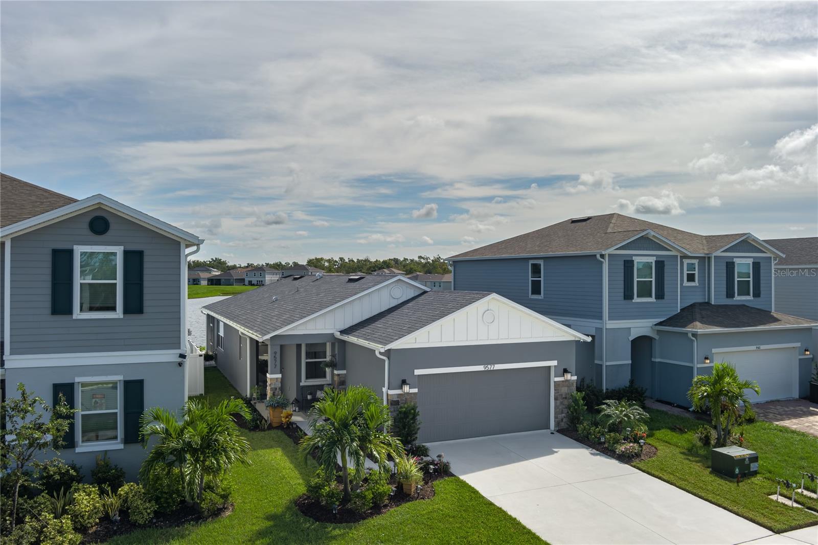 Why wait on new construction and spend months (and extra money) adding upgrades, when this 1.5-year-old home already has it all? With over $100,000 in upgrades and enhancements—including builder options and post-closing owner improvements—this property is a rare find and an incredible value compared to buying directly from the sales center.
This thoughtfully designed 3-bedroom, 2-bathroom home with den and 2-car garage offers a modern, functional layout paired with high-end finishes throughout. From the moment you arrive, you’ll notice the quality—beginning with the 8-foot beveled glass front door and custom Larson storm door. Inside, you’ll find 9-foot ceilings, 8-foot interior doors, and luxury vinyl plank flooring that flows seamlessly throughout the entire home.
The chef-inspired kitchen is loaded with upgrades:
42” soft-close cabinetry with dovetail construction, crown molding, and under-cabinet lighting
Quartz countertops & marble backsplash
Premium stainless steel appliance suite featuring Whirlpool French door refrigerator, Whirlpool Smart microwave (convection, air fry, grill & steam), KitchenAid Smart range (convection, air fry, steam bake), and high-capacity dishwasher with third rack
Matte black quartz undermount sink with Moen MotionSense Wave faucet
Walk-in pantry
The primary suite overlooks a private pond view and features custom cellular blinds, a generous walk-in closet, and a spa-like ensuite with double sinks, upgraded Moen fixtures, and a frameless glass shower. Two additional bedrooms and a dedicated den/office offer versatility and comfort.
The living and dining area boasts a vaulted ceiling and opens to a screened lanai with hurricane shutters, plus an extended 16x12 patio with retractable 12-foot awning—perfect for enjoying the water view with no rear-facing neighbors.
Additional owner-installed enhancements add tremendous value:
Whole-house generator ready with transfer switch
Guardian security system with cameras
Ethernet outlets in office, living room, and primary bedroom
Exterior surge protection
Auto HVAC cleaning system
Water circulation pump for strong pressure & instant hot water
Water softener
Four overhead garage storage racks
Located in the desirable Saw Grass Lakes community, this home offers the convenience of no CDD fees, no flood zone, and easy access to shopping, beaches, St. Petersburg, Sarasota and the upcoming BayCare medical center.
This home is truly move-in ready, loaded with upgrades, and a far better value than building new.