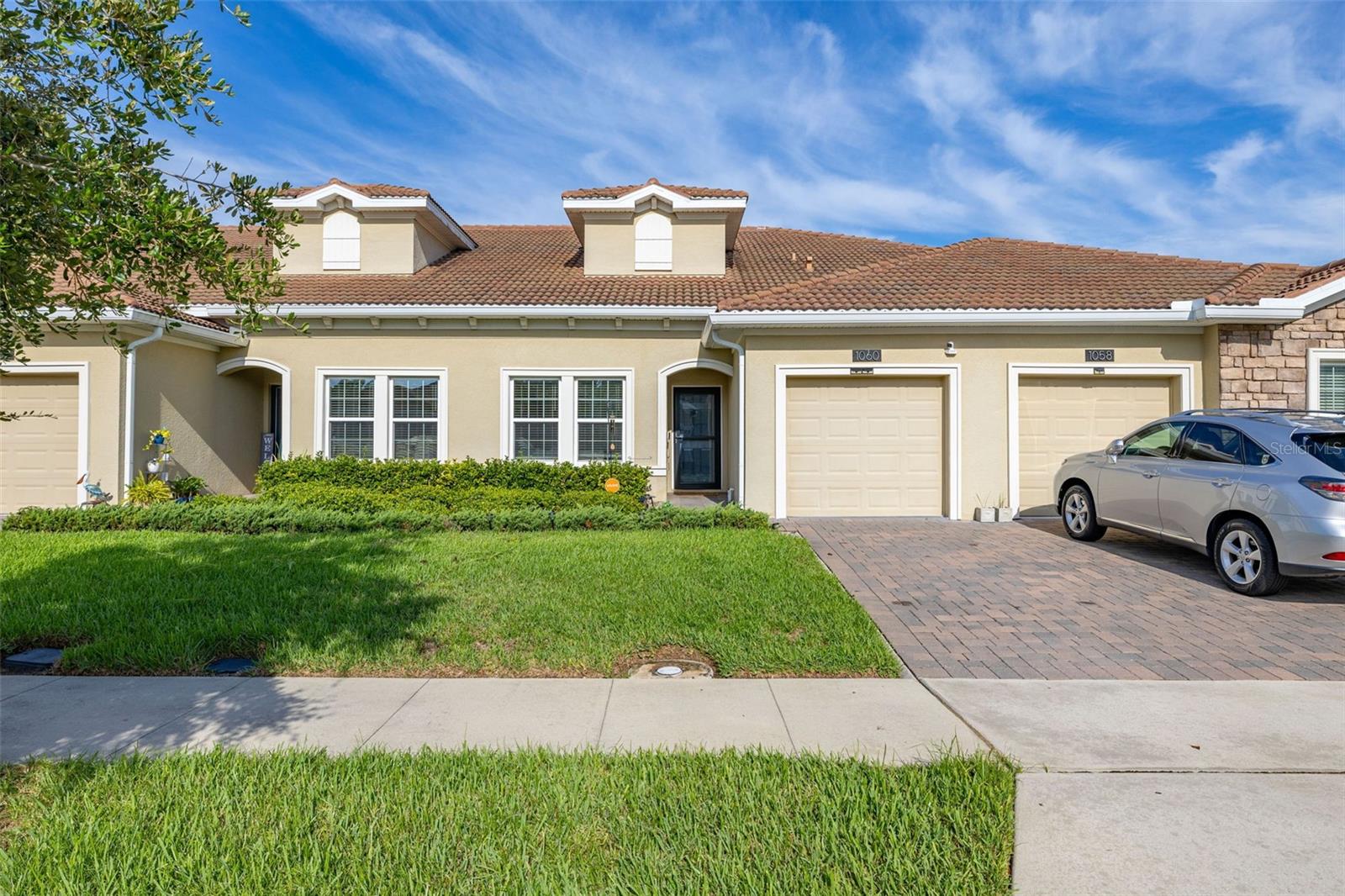 Upscale Resort-Style Living in Champions Gate! Experience refined Florida living in this beautifully maintained 2-bedroom, 2-bath home, located in the exclusive, guard-gated community of Champions Gate. Built in 2020, this residence offers a bright, open-concept layout ideal for both everyday living and entertaining. The chef’s kitchen is thoughtfully appointed with quartz countertops, stainless steel appliances, solid wood cabinetry, and a generous bar-top peninsula. It flows seamlessly into the dining and living areas, creating a welcoming space to gather. Just beyond, a screened lanai offers a peaceful outdoor retreat surrounded by professionally maintained landscaping.
HVAC is 1 Year Old!! Water Filtration System, Solar Panel System making utilities to be under $30!!
The spacious primary suite features a large walk-in closet and a well-appointed en-suite bath with a double vanity and a glass-enclosed walk-in shower. A secondary bedroom and guest bath provide versatile space for visitors or a home office. Additional features include a separate laundry room with built-in storage, a walk-in kitchen pantry, and a tile roof designed for long-term durability.
Living in Champions Gate means enjoying an exceptional lifestyle. Homeownership includes access to championship golf, multiple resort-style pools and spas, a private waterpark, playgrounds, a volleyball court, and a full-service clubhouse complete with a restaurant, Tiki bar, fitness center, arcade, and movie theater. Cable television, lawn care, and 24-hour gated security are also included. Ideally located just minutes from fine dining, shopping, and major highways, this home offers the perfect blend of comfort, convenience, and luxury. Schedule your private showing today—this is resort living at its finest.