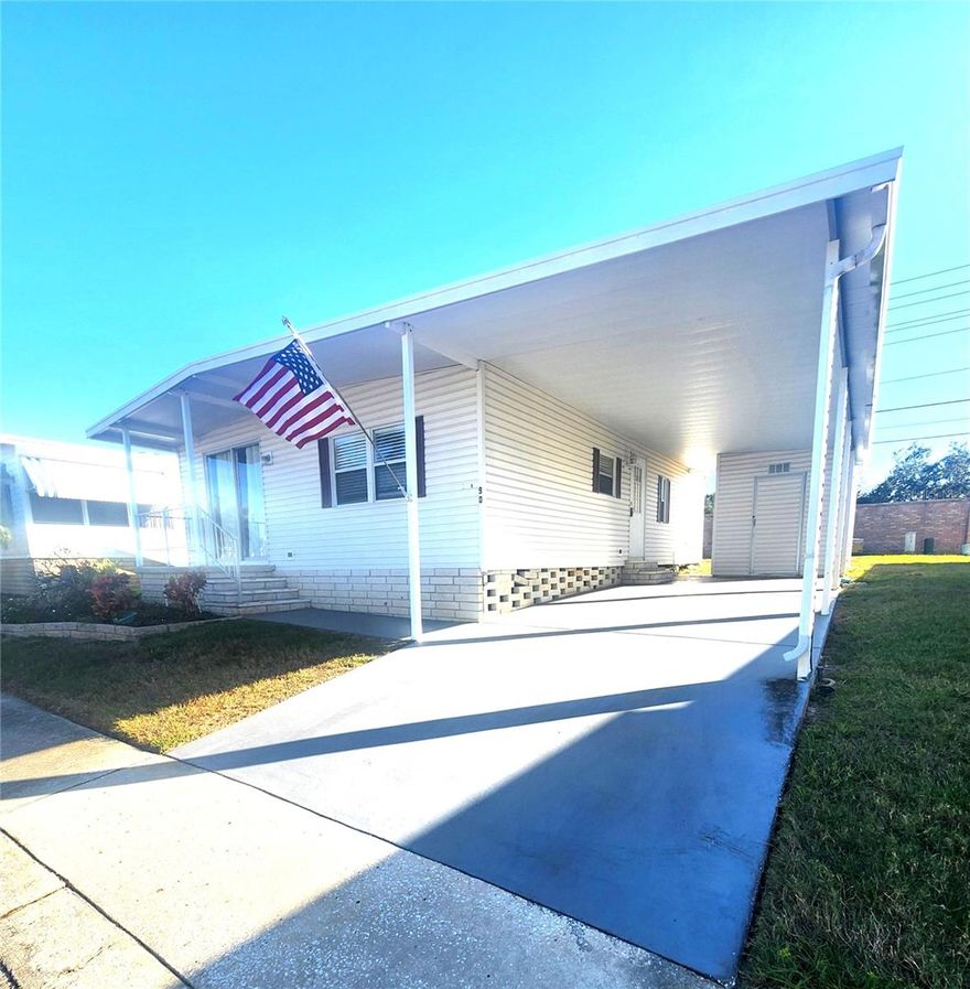 WOW! LOWEST PRICED 2 BR! This Light & Bright Home shows pride of ownership with an American flag in front and located in friendly community with plenty of activities. There is a room with storage and Full Size Washer/Dryer. The Kitchen has a pantry and Breakfast bar with a brick wall to add character. The Kitchen opens to a Dining Room with Built-in Shelves and Cabinets. Laminate floors throughout. Open floor plan with spacious Living Room, and sliders leading to a Patio to relax and get some fresh air. Spacious Master Bedroom has a walk-in closet and Master Bath with a walk-in shower. Newer A/C 2022. Walk to the Clubhouse to enjoy heated pool with pool deck, shuffleboard, bocce and activities which include Bingo, Cards, Cribbage, Line Dancing, Happy Hour and more! Close to Honeymoon Island Beach, restaurants, grocery, golf courses & more! Don’t miss out, Come View Today!