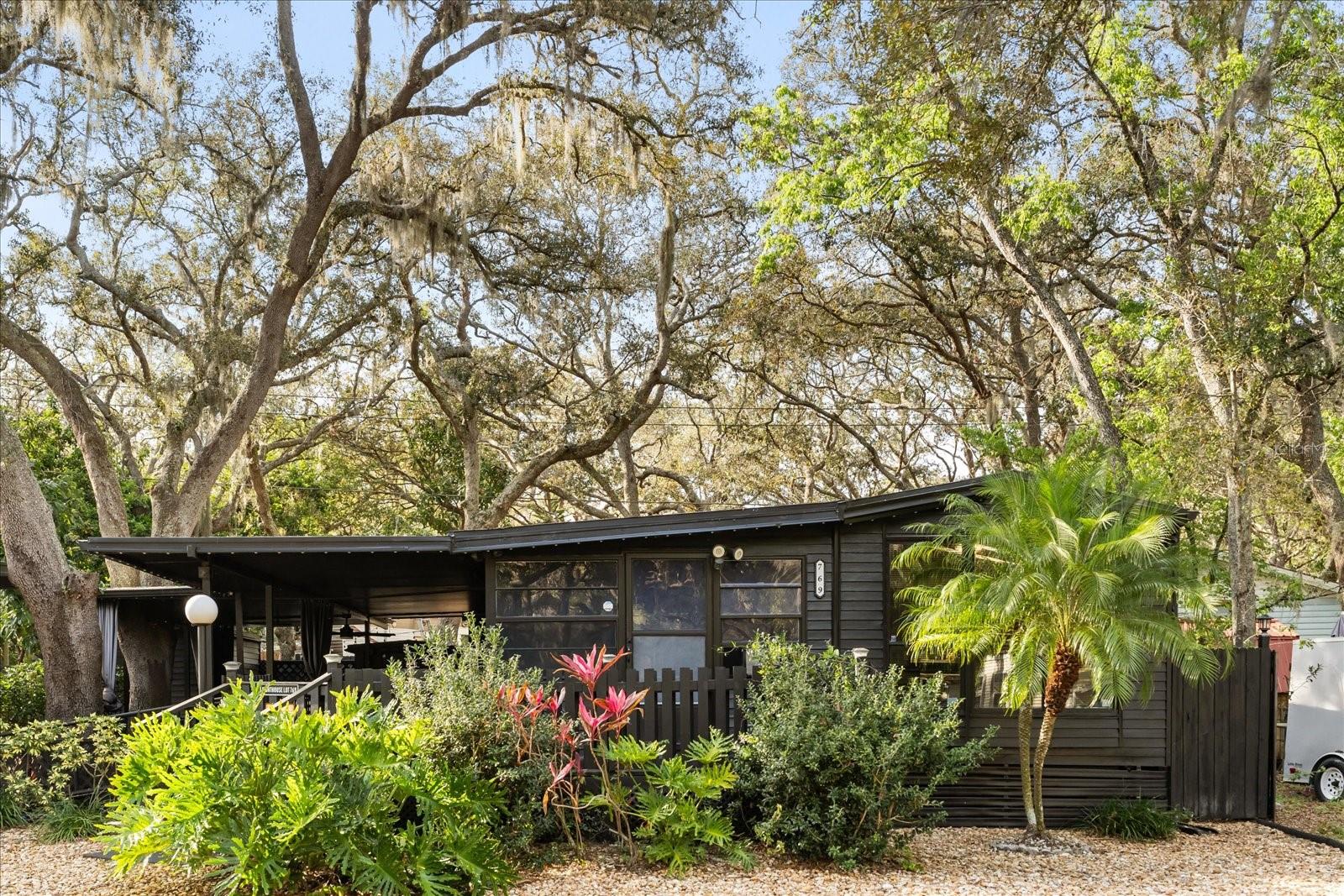 Charming 2-Bedroom Home with Resort-Style Amenities & Investment Potential in Apopka! ????
Discover your own slice of paradise with this charming 2-bedroom, 1-bath manufactured home on owned land in the heart of Apopka! Situated on two separate lots (#767 & #769), this property offers incredible flexibility—build an additional home on the second lot to rent out for extra income or create your own family compound.
Step outside to enjoy the expansive L-shaped deck, with 8x25 feet of covered space, perfect for entertaining or relaxing in the shade. A 6x18 foot front porch provides a cozy spot for your morning coffee, while the paver patio with privacy curtains creates a serene outdoor retreat. Customize your ambiance with your own gemstone lighting system for the perfect evening setting.
Inside, the home features durable luxury vinyl flooring throughout, new blinds, and a kitchen equipped with stainless steel appliances, including a refrigerator, stove, and range hood. Recent upgrades include a new breaker box for peace of mind and a state-of-the-art security system, with security cameras and a monitoring system included in the larger bedroom for added safety. A 2-car carport provides convenient covered parking.
Beyond your doorstep, enjoy access to resort-style HOA amenities, including a swimming pool, kiddie pool, basketball court, playground, shuffleboard, horseshoes, mini golf course, and an on-site country store with a restaurant. This 24-hour virtual gated community also allows short-term rentals, making it an excellent opportunity for investors or those seeking a vacation home.
With the ability to develop an additional property, this home offers both a personal retreat and income-generating potential. Don’t miss out on this incredible opportunity! Cash Offers Only. Schedule your showing today and experience the Florida lifestyle at its best!
