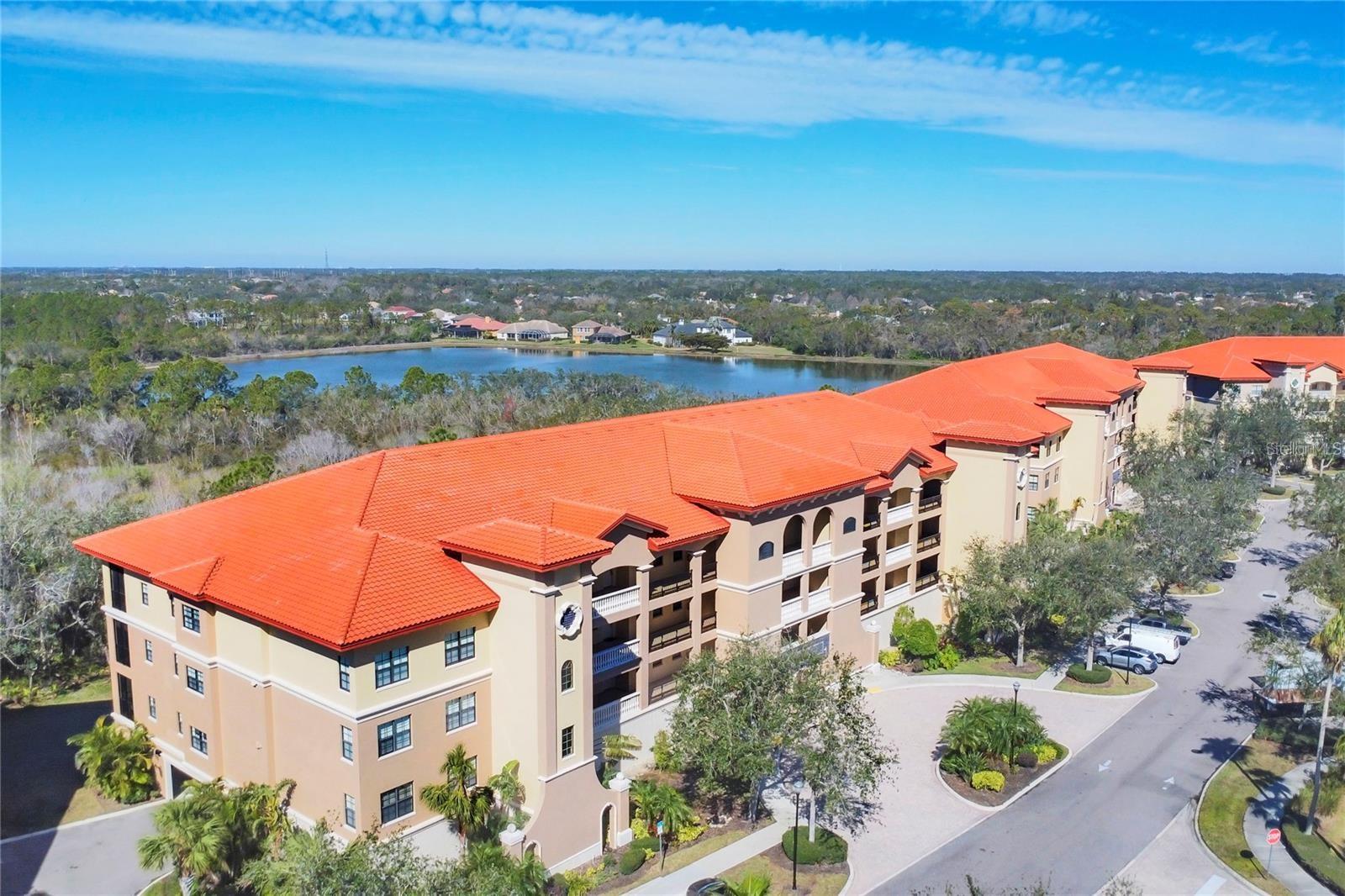 Annual Unfurnished . Beautiful, updated and immaculate, this 3 bedroom, 2 bath condo is in peaceful, private, gated and secure Lake Vista. This community offers, resort-style living in a premium Lakewood Ranch location. This inviting second-floor unit (there is an inside elevator) is situated in a wooded preserve area, creating a treehouse feel as you enter the front door and are met by the view. The open floor plan layout ensures lots of entertainment and living options. There is a large, screened lanai overlooking the wooded area, complete with electric sunshades to ensure maximum comfort and year-round use. All windows and door sliders have impact resistant glass. An assigned parking space as well as an adjacent storage unit is located on the first floor, underneath the building for ease of coming and going! Both spots are adjacent to the inside entry of the building. High ceilings with crown molding and tray ceilings. All counters are granite; All floors are tile or laminate (no carpet) for ease of maintenance. The large Primary suite offers a door to the lanai as well as a generous, spa-like bath with separate tub, walk-in shower, dual sinks and a large walk-in closet (the extra shelves are easily removed). The other two bedrooms, one of which Is perfectly situated for an office or den, are tucked away nicely from the Primary Suite. A second full Bath with walk-in shower and a Laundry room complete the condo. Lake Vista has a dynamic Clubhouse, complete with a lounge area, entertaining kitchen, fitness center, huge community pool and spa, and outside gathering areas. Take a short walk to LWR "Main Street" as well as Nature's Trail, where you will find multiple restaurants, interesting shops, theatres and, frequently, special events. Nearby is the newly developed Waterside Place, with tons more dining, shopping and various activities to check out. I75 ,The UTC Mall, Benderson Park, Lakewood Ranch Hospital, Sarasota/Bradenton Airport, Mote Marine Aquarium – all just minutes away. No Pets allowed for tenants.