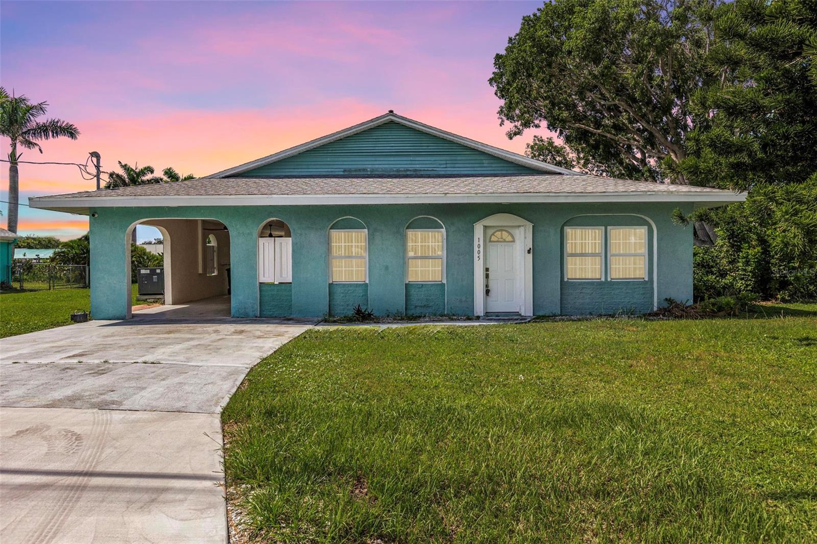 Step back in time without sacrificing modern comfort in this beautifully preserved 1964 Kluge Florida home, nestled just minutes from the Gulf on a canal off Ainger Creek from your personal dock. The original home has been added onto creating a larger living space than the original footprint. This property is a rare find in charming Englewood. It is your time to own a piece of historical architecture on an oversized corner lot with water access. Just two fixed bridges to the waters of the Intercoastal Waterway and the Gulf of Mexico.
The kitchen has been updated with new cabinets, counter tops and appliances. Both bathrooms have also been updated to provide a more modern feel and comfort. In the bedrooms you will find ample closet spaces and other storage areas within the house including the oversized laundry room. The AC was replaced in 2021and the roof is 12 years old.
The oversized cinder block carport is large enough for your cars or any Florida activity toys you may want to bring with you to enjoy Gulf Coast Living.
Centrally located for easy access to beaches, restaurants and shopping and boat ramps. Dearborn street is just a few miles North with its restaurants, shops, music venue and events. Highlighted is the Thursday farmers market and classic car show. Want to explore farther? Venice to the North and Boca Grande to the South.
This home blends the character and craftsmanship of the past with the ease of modern living on the coast of Florida. Ideal for those who appreciate history, coastal charm and water activities.
Bring the boat, kayaks, fishing gear and explore the waters of Englewood and beyond.
This home did have water intrusion from hurricane Milton and has been remediated.