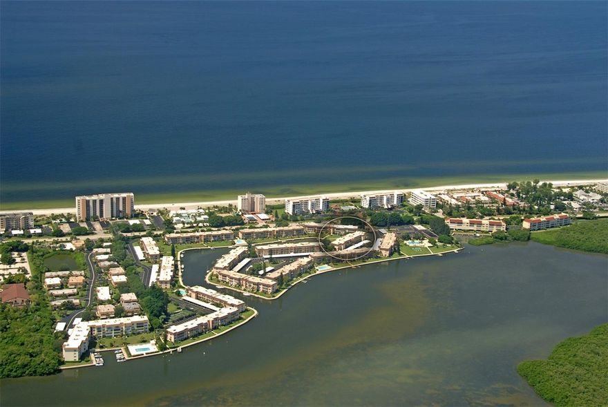 Make your dreams come true with this beautiful waterfront condominium located at the popular Longboat Harbour resort! Enjoy gorgeous views of the water the moment you step in. This newly renovated 2BD/2BA second floor unit offers a roomy open floor plan with plenty of natural light, is being sold turnkey furnished. New Luxury Vinyl flooring and hurricane windows has been installed throughout. The updated kitchen has Granite countertops and new appliances. Benefit from your own private washer and dryer located in the guest bathroom. The inclusive patio with new sliders oversees the canal as well as a partial view of the gulf. One assigned covered parking space is included. Sorry, no pets are allowed. Conveniently located on mid Longboat Key between the quaint towns of Anna Maria Island and Lido. Saint Armand's Circle and Downtown Sarasota is only minutes away with fine dining, specialized shopping, art galleries, Sarasota Orchestra, Van Wezel theater and more... Great investment property, second home or weekend getaway. Longboat Harbour resort is a gated community with on site management. Amenities include: four heated swimming pools, tennis courts, sauna room, art studio room, bike storage, BBQ grills, clubhouse, billiard room, woodshop facility, fitness center, pickleball courts, putting green, shuffleboard, kayaking storage, boat docks and a fishing station. Deeded beach access is located across the Street with a pavilion which has restrooms, showers, chair storage, car/boat washing. New roof 2025.