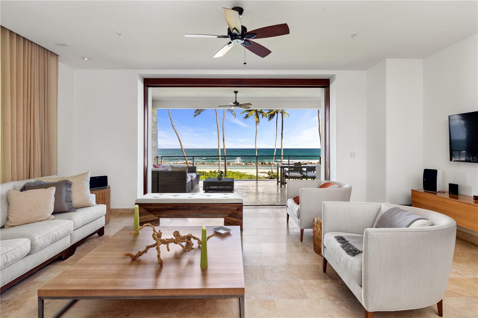Introducing West Beach, a Ritz Carlton Reserve Residence that redefines coastal luxury, offering an unparalleled beachfront living experience in Dorado, Puerto Rico. This remarkable condo, nestled along the pristine shores of Dorado Beach Resort, provides a rare opportunity to indulge in a captivating blend of serene natural beauty and contemporary elegance. Step into your private sanctuary and immerse yourself in the soothing ambiance of this meticulously crafted residence. The spacious open-concept floor plan seamlessly connects the living, dining, and kitchen areas, creating an ideal space for entertaining guests or enjoying quality time with loved ones. Large floor-to-ceiling windows invite an abundance of natural light, illuminating the stunning interior and offering captivating views of the azure ocean beyond. The gourmet kitchen, a culinary enthusiast's dream, features top-of-the-line Wolf and Sub-Zero appliances, custom Poliform cabinetry, and an expansive island with sleek countertops, providing both functionality and style for casual meals or lavish dinner parties. The master suite serves as a tranquil oasis, offering a private retreat to unwind and rejuvenate. Wake up to the gentle sound of waves and enjoy the sunrise from your own balcony. The en-suite bathroom boasts a luxurious spa-like atmosphere, complete with a deep soaking tub, a spacious walk-in shower, and an outdoor shower experience. Two additional bedrooms are thoughtfully designed to provide comfort and privacy for family members or guests, each tastefully appointed. Wake up to stunning ocean views or relax in the cozy reading nook, creating your own world of tranquility. Immerse yourself in the sheer beauty of beachfront living at West Beach, where every day brings a sense of tranquility, luxury, and endless possibilities. Don't miss the chance to own this exceptional property and create lasting memories amid the captivating beauty of Dorado Beach.