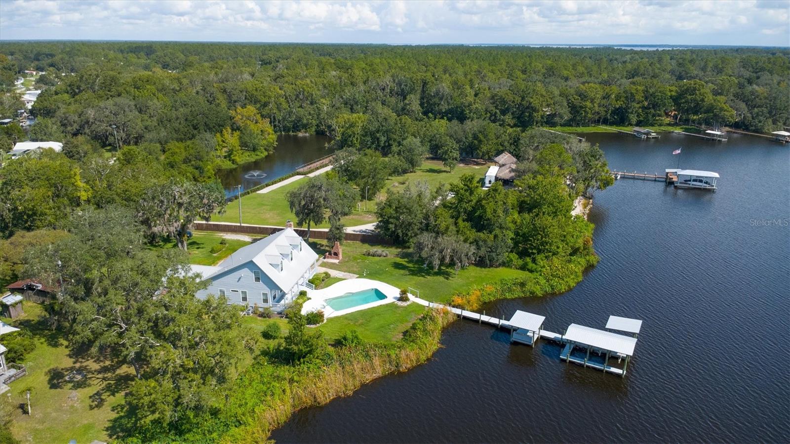 Welcome to your riverfront retreat! This beautiful 3-bedroom, 3-bath home sits on 1.28 acres along the majestic St. John’s River. Enjoy the convenience of a pool overlooking your private dock with a boat lift, perfect for days on the water. Inside, the master suite is located on the main level for comfort and ease. Step outside to a sparkling pool, a charming front porch, and a spacious back porch designed for entertaining and relaxing with family and friends. With stunning views and endless opportunities for outdoor living, this home truly captures Florida’s lifestyle at its best.
